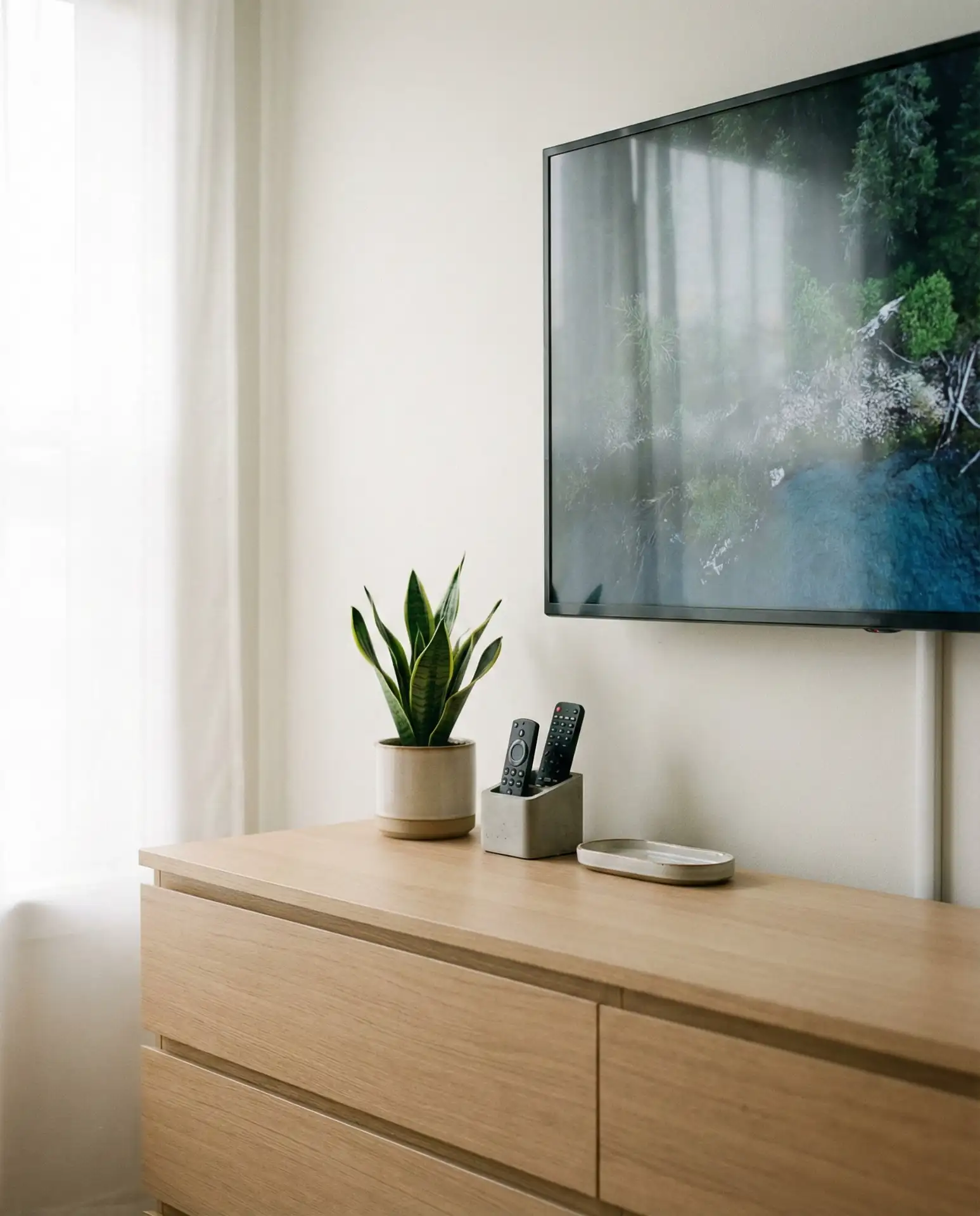 Bedroom with TV Mounted Above Dresser 1