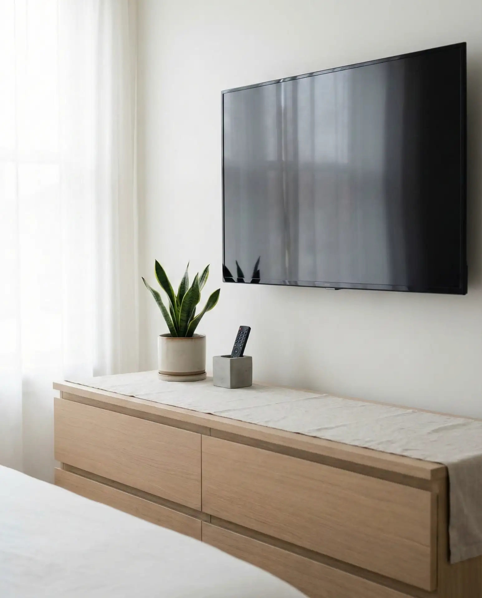 Bedroom with TV Mounted Above Dresser 2