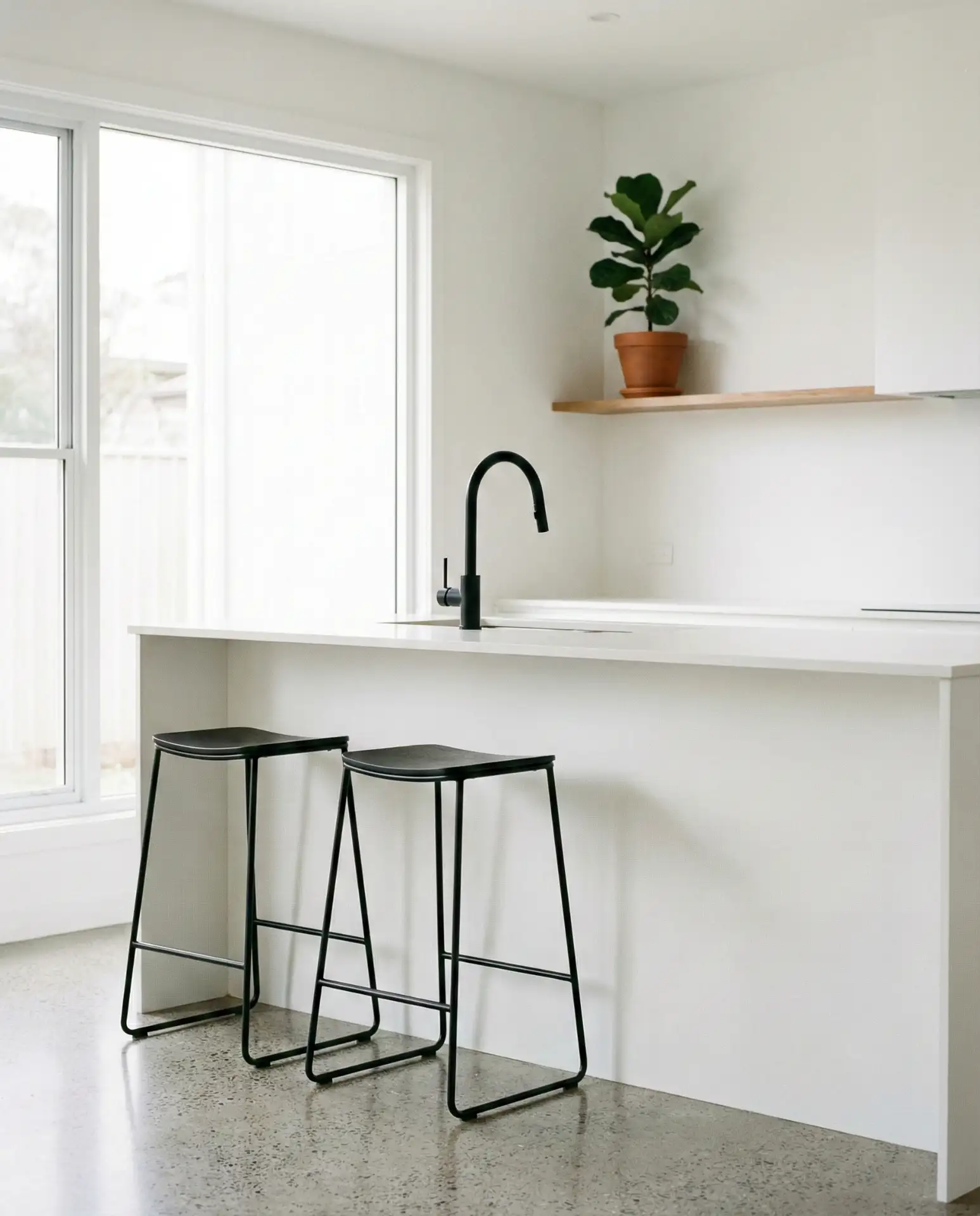 Minimalist White Kitchen with Black Accents 2