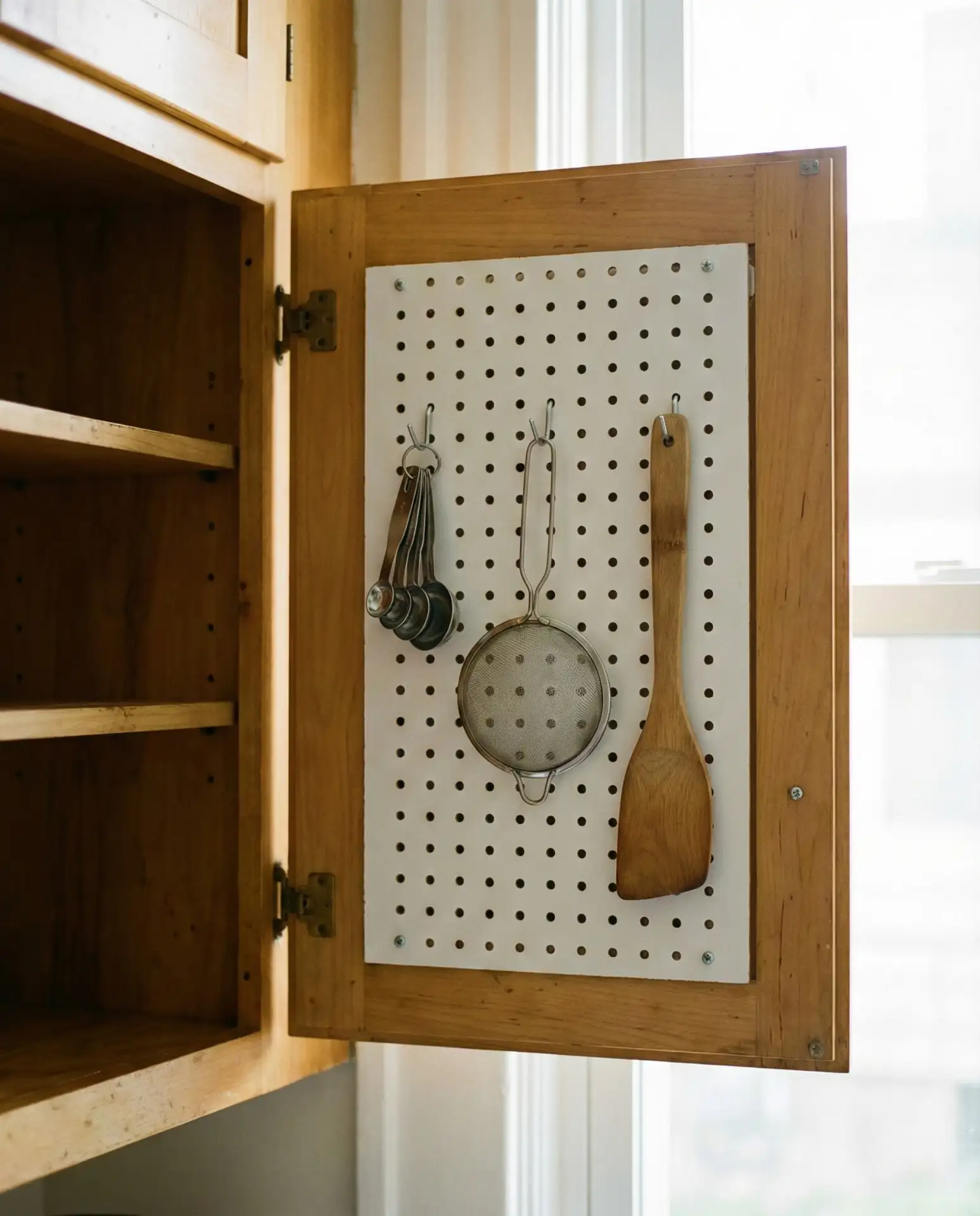 Pegboard Panels Inside Cabinet Doors 1