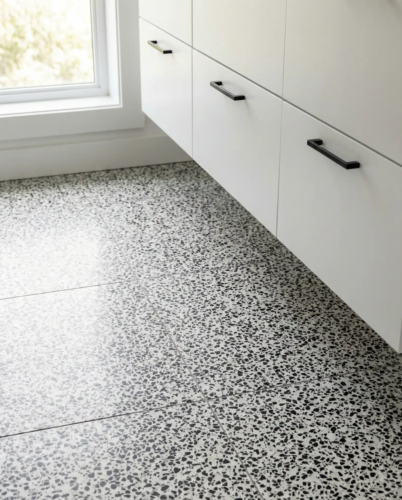 Terrazzo-Style Flooring with Black and White Chips 1