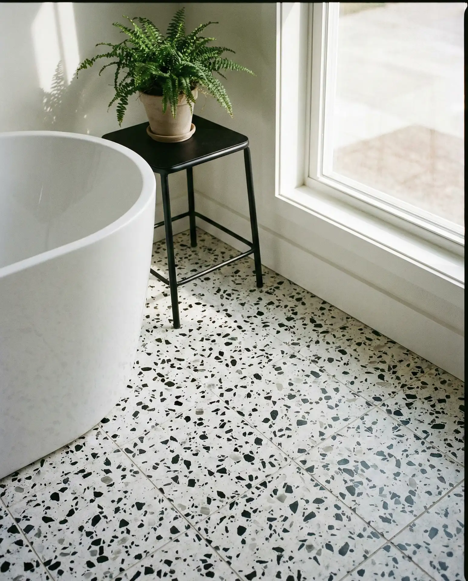 Terrazzo-Style Flooring with Black and White Chips 2