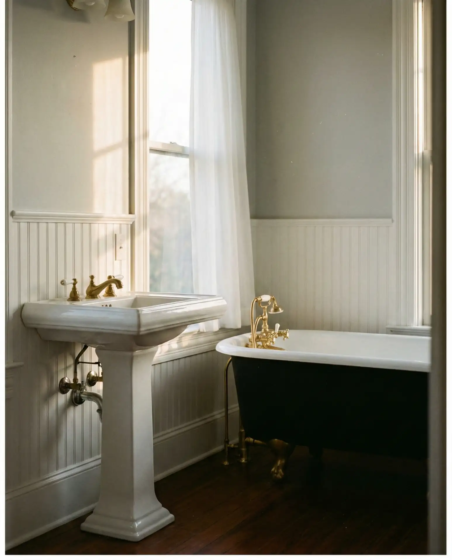 Vintage Pedestal Sink and Clawfoot Tub 1