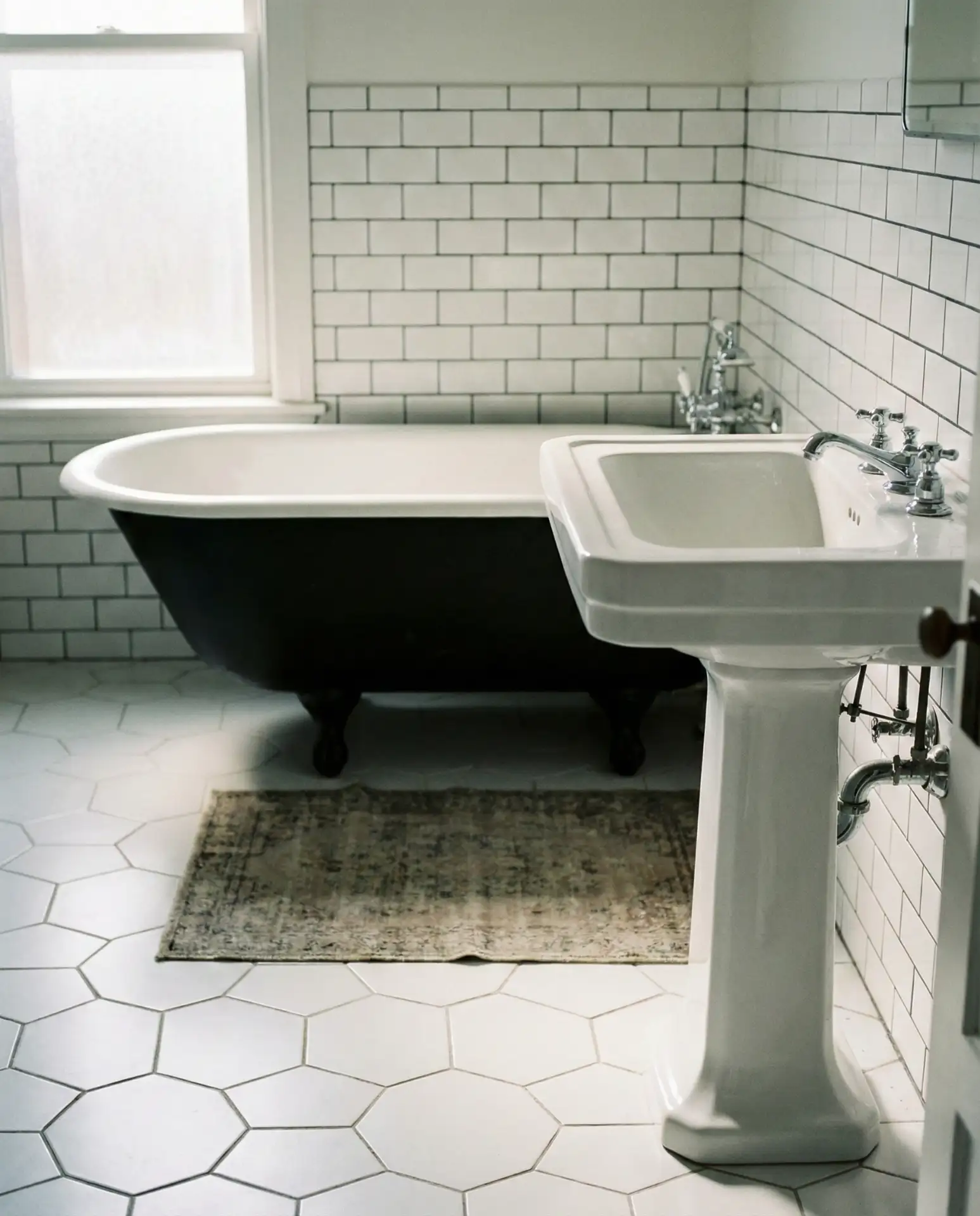 Vintage Pedestal Sink and Clawfoot Tub 2