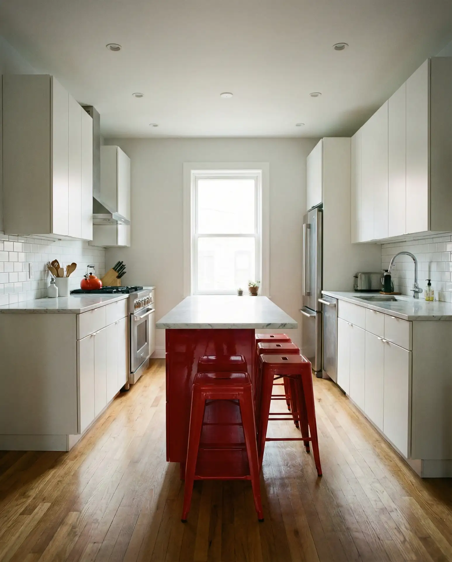 White Kitchen with Pink and Brass Details 1