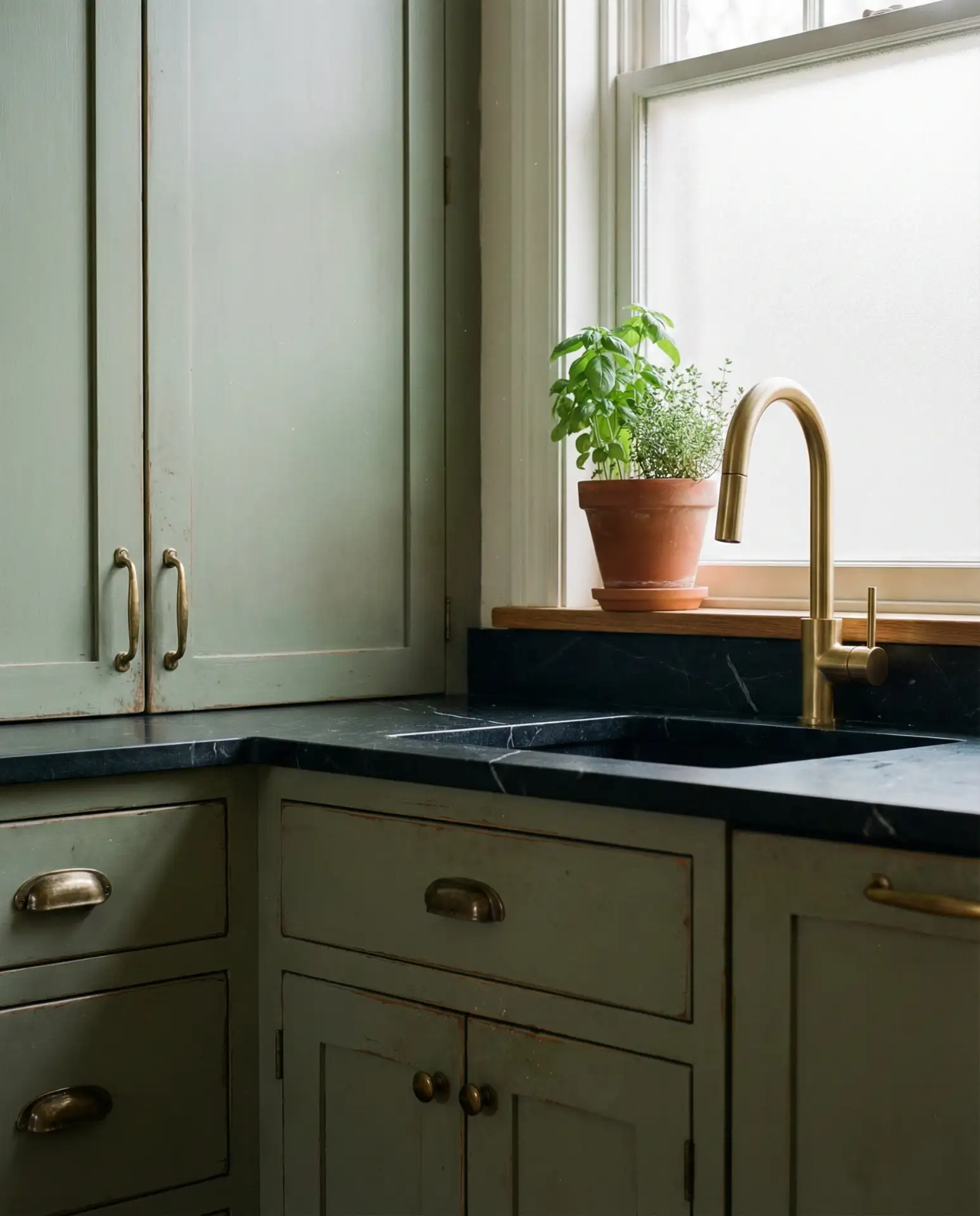 Black Countertop Kitchen with Vintage Green Cabinets 2
