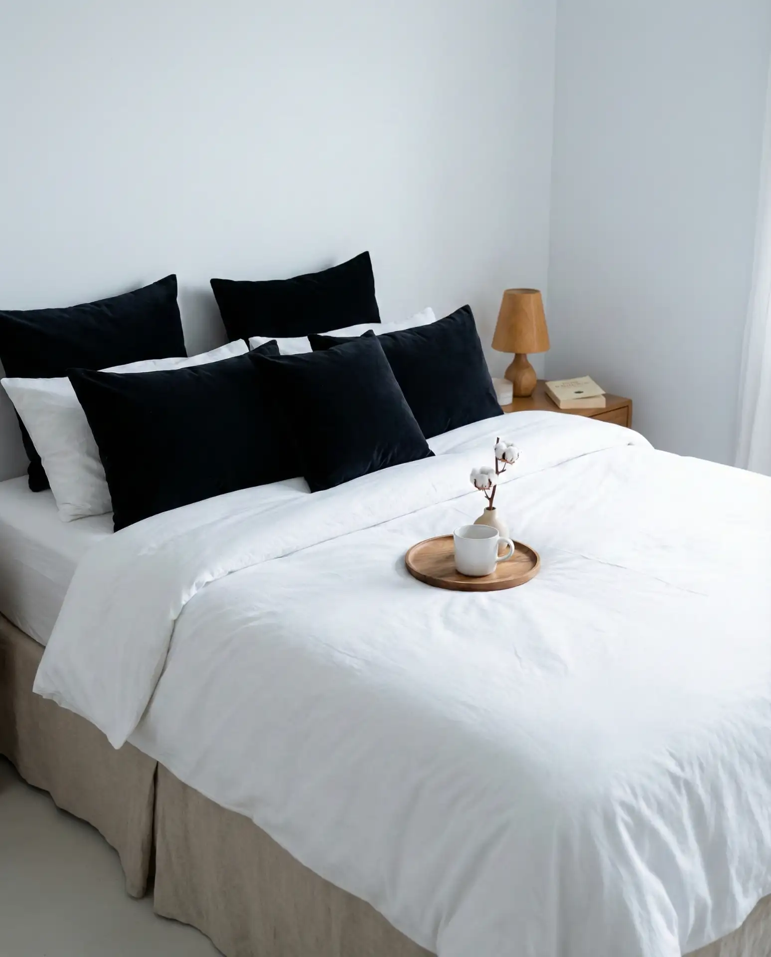 Black and White Bedding with Warm Wood Accents 1