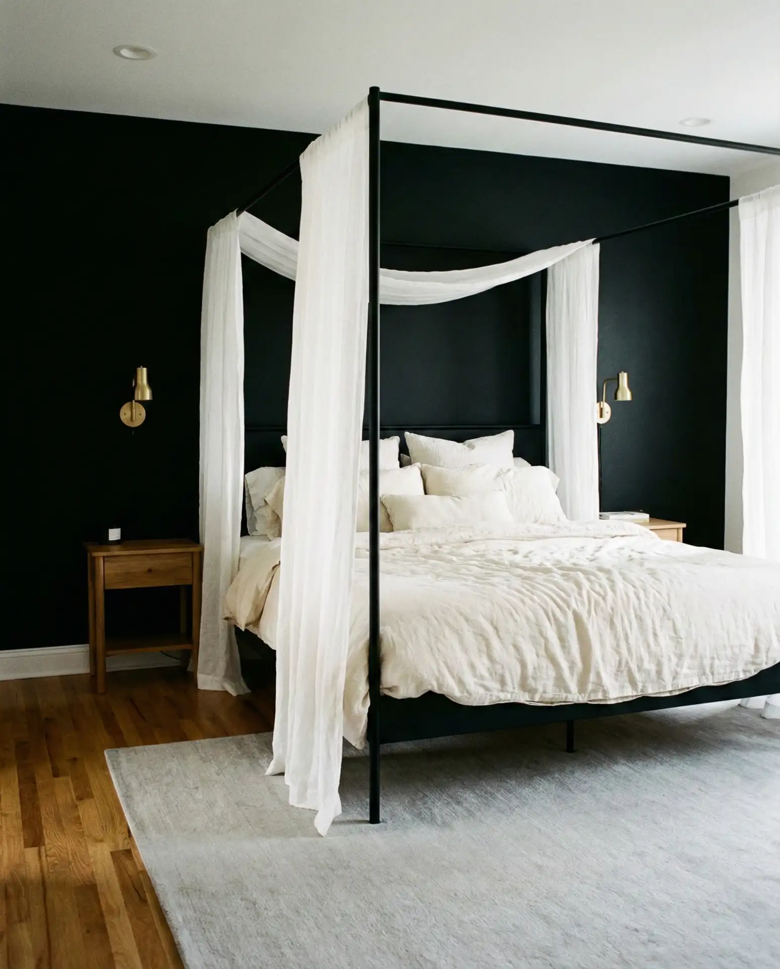 Canopy Bed Against a Black Wall 1