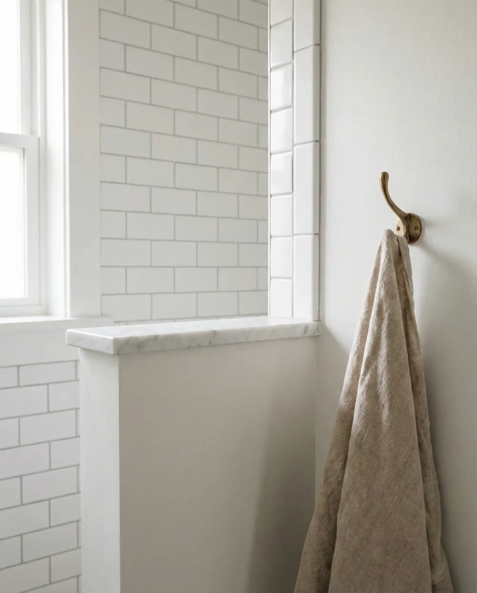 Corner Shower with a Half-Wall and White Subway Tile 2