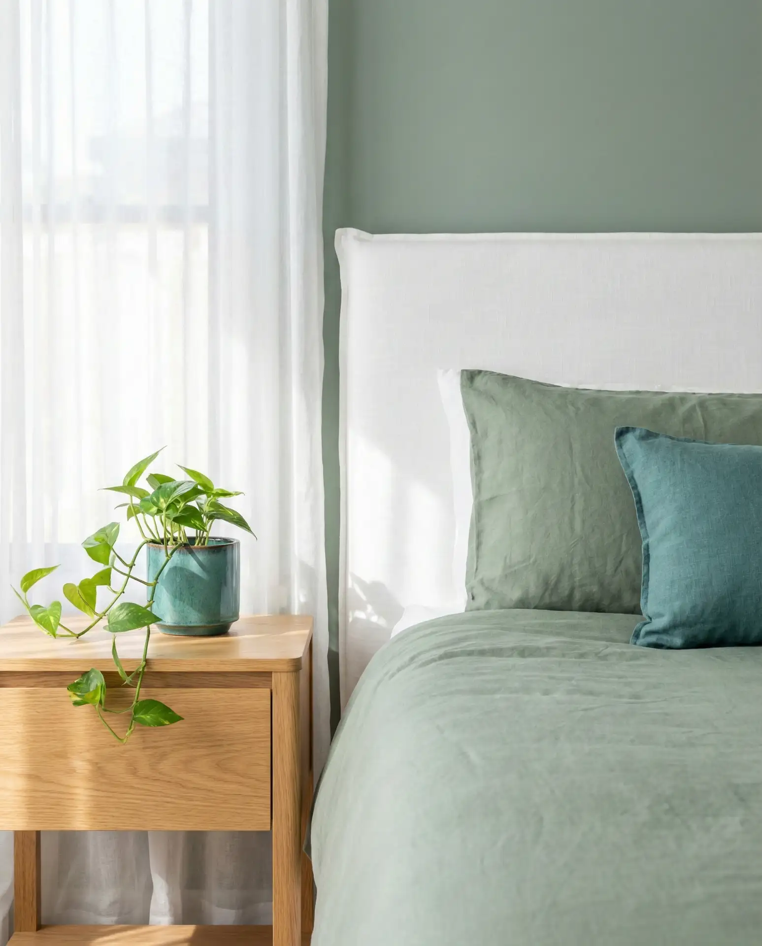 Green and White Bedroom with Sage and Teal Accents 1