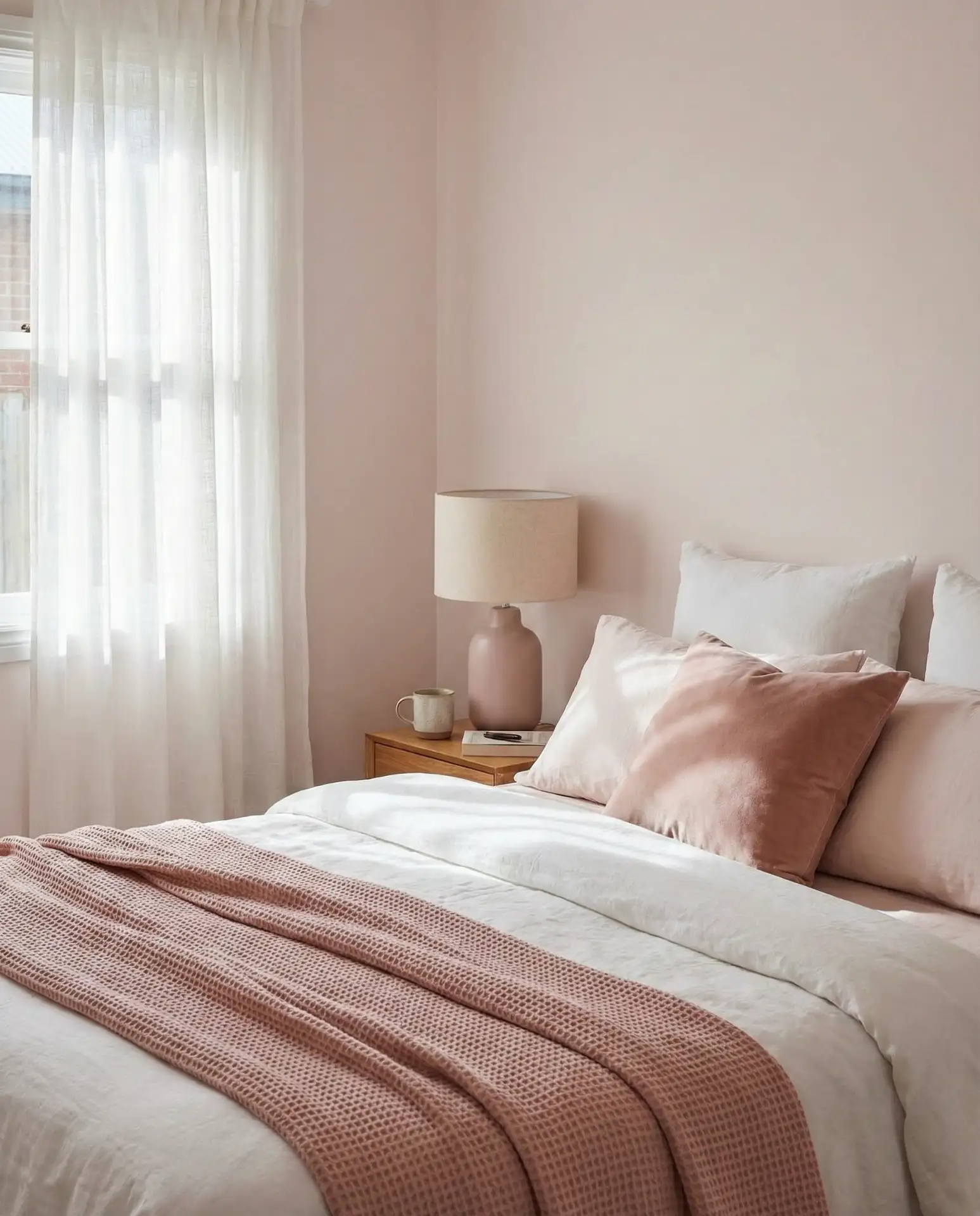 Pink and White Bedroom with Soft Layered Textures 1