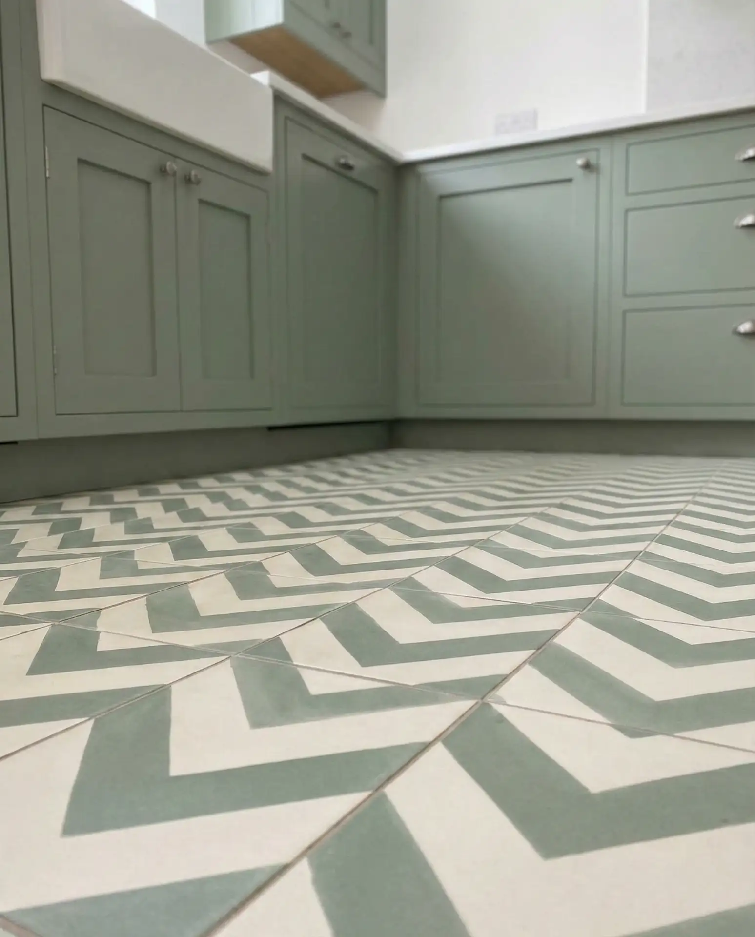 Sage Green Cupboards with Geometric-Tile-Floors 1