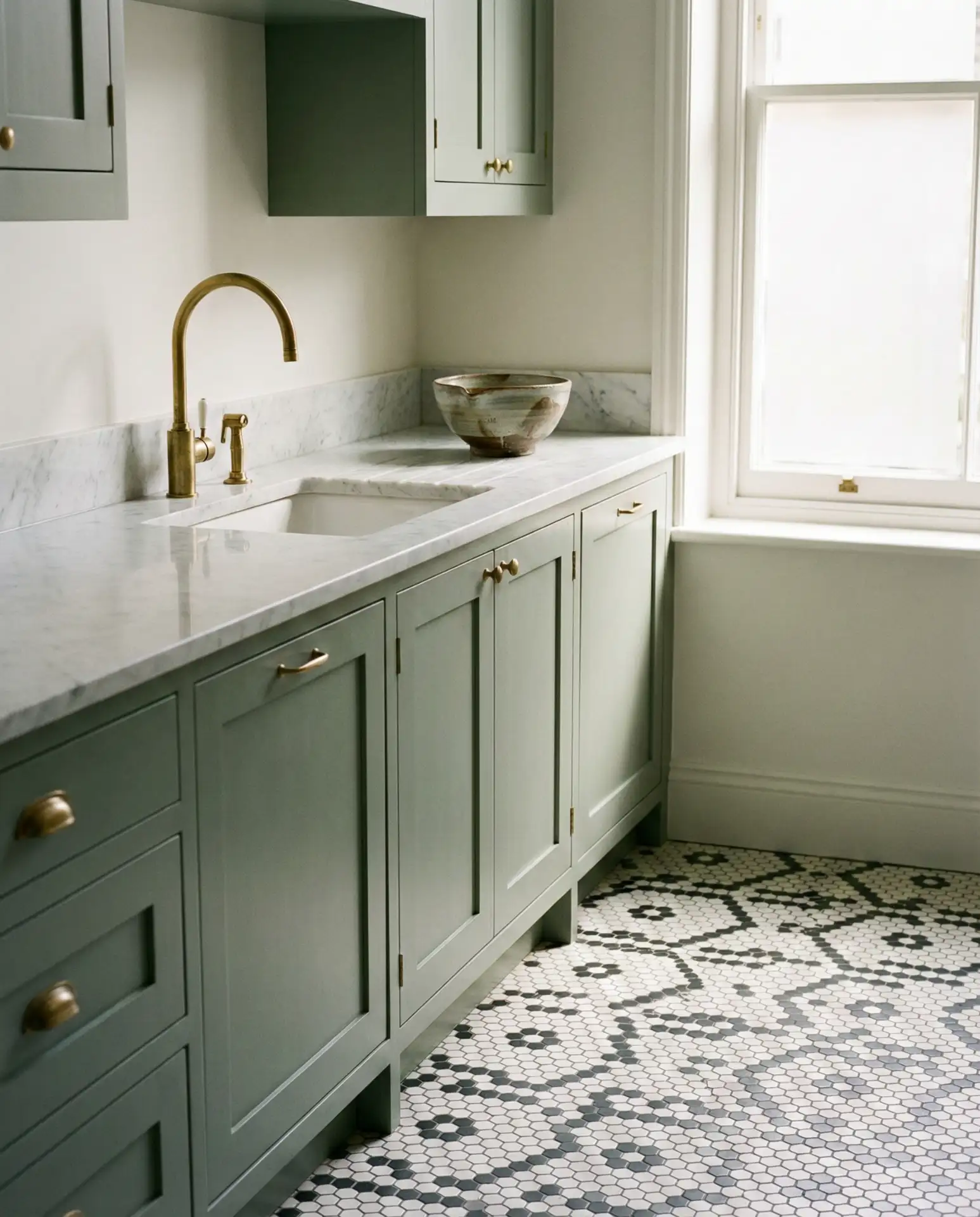 Sage Green Cupboards with Geometric Tile Floors 2