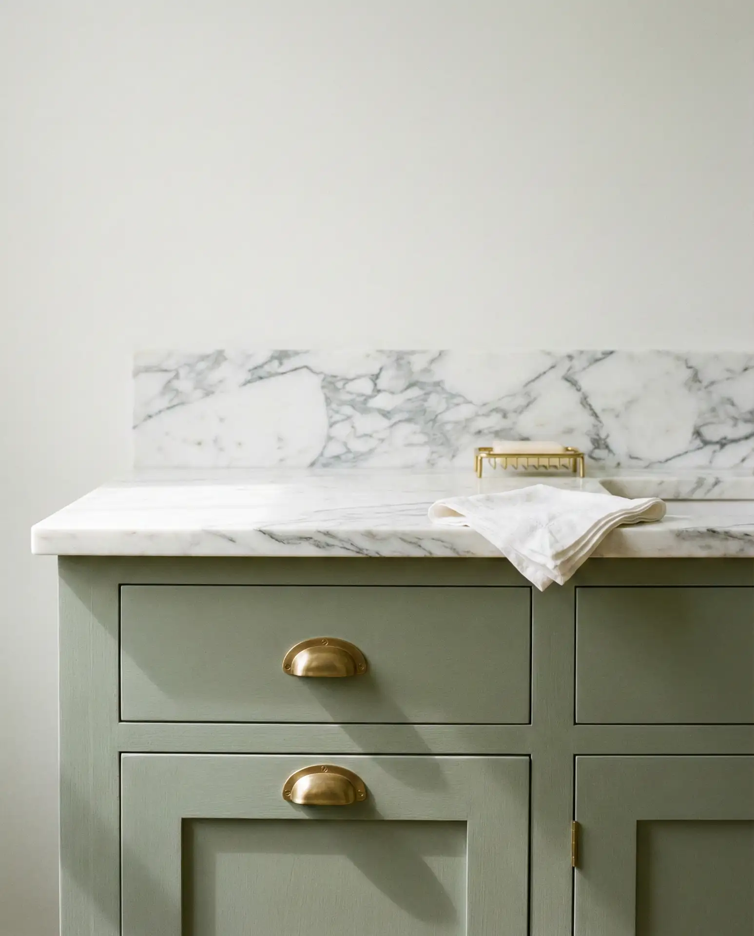 Sage Green Cupboards with White Marble Counters 1