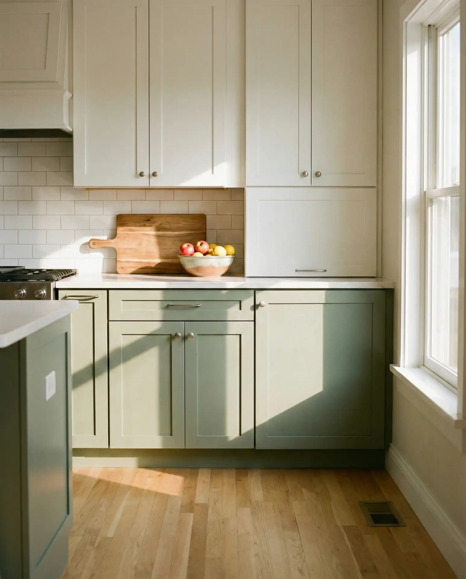 Sage Green Kitchen with White Tiles and Wood Accents 1