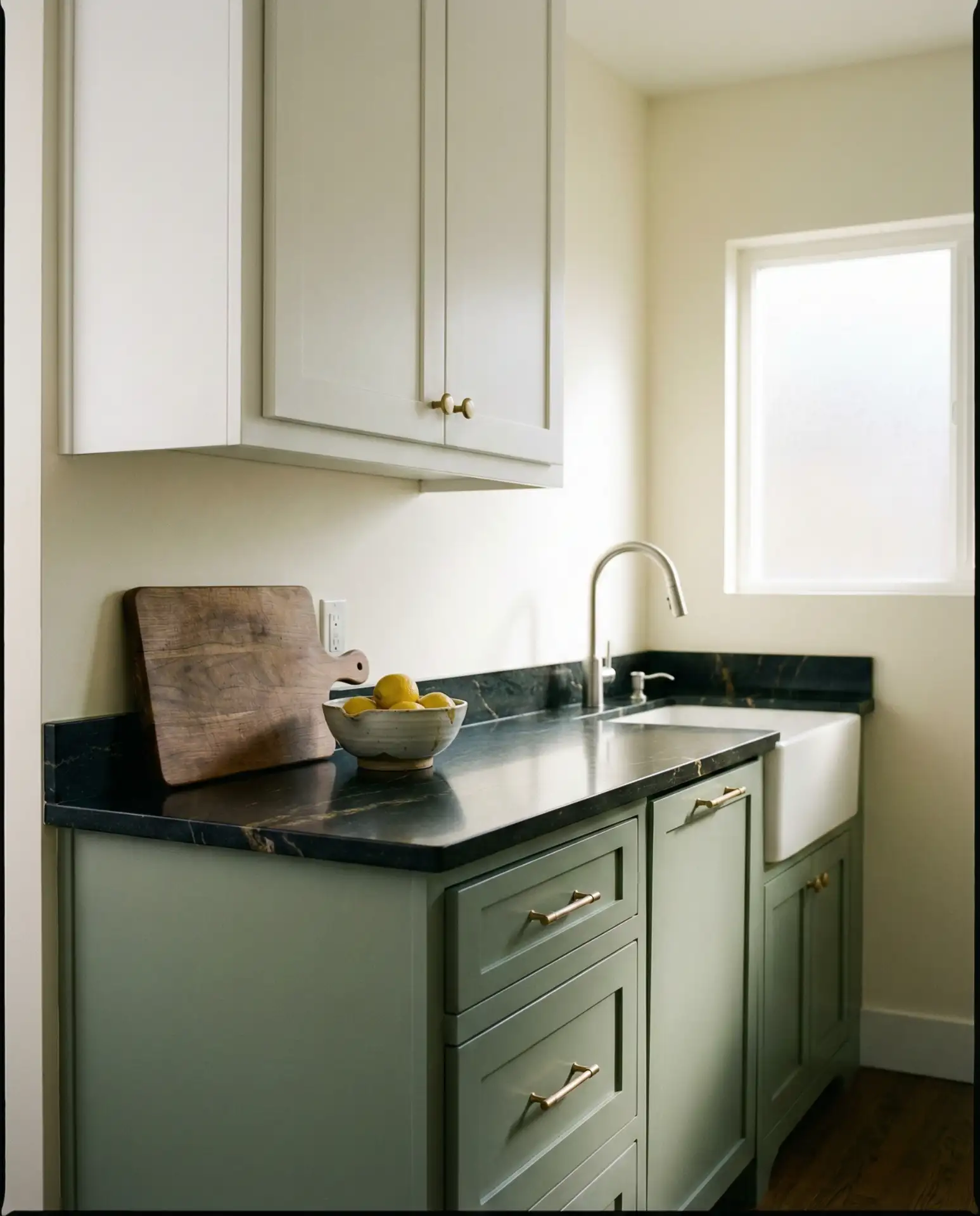 Sage Green Lower Cabinets with Black Granite Countertops 1