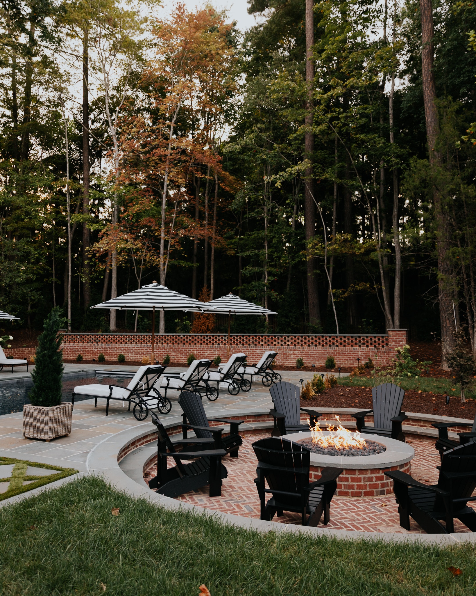 Our Sunken Fire Pit Paired With Black Adirondack Chairs