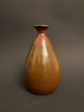 Brown ceramic bud vase with narrow neck