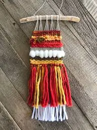 Bright woven wall hanging, orange wea...