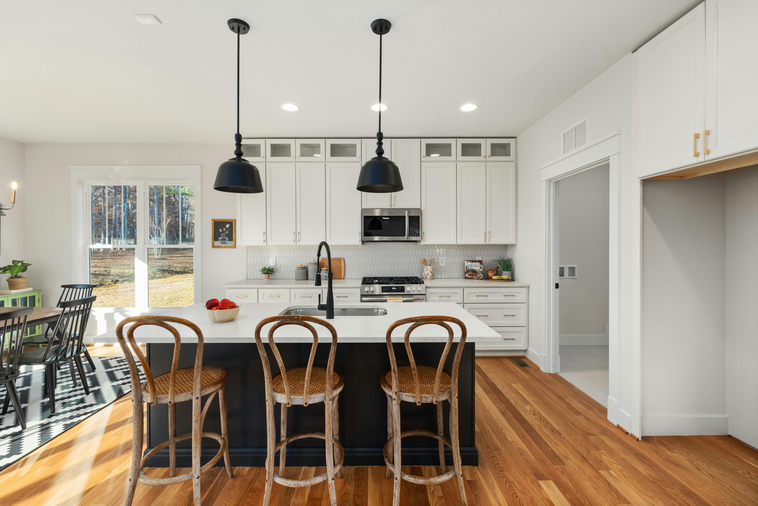 Bright, contemporary kitchen featuring wood accents and farmhouse aesthetic.