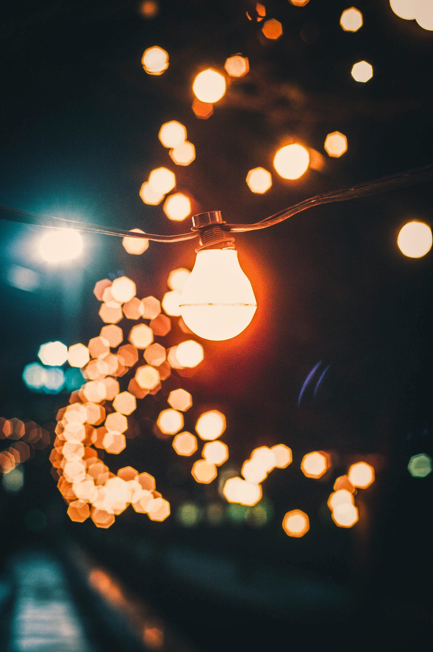 Captivating string lights with a bokeh effect, creating a warm and inviting night atmosphere.