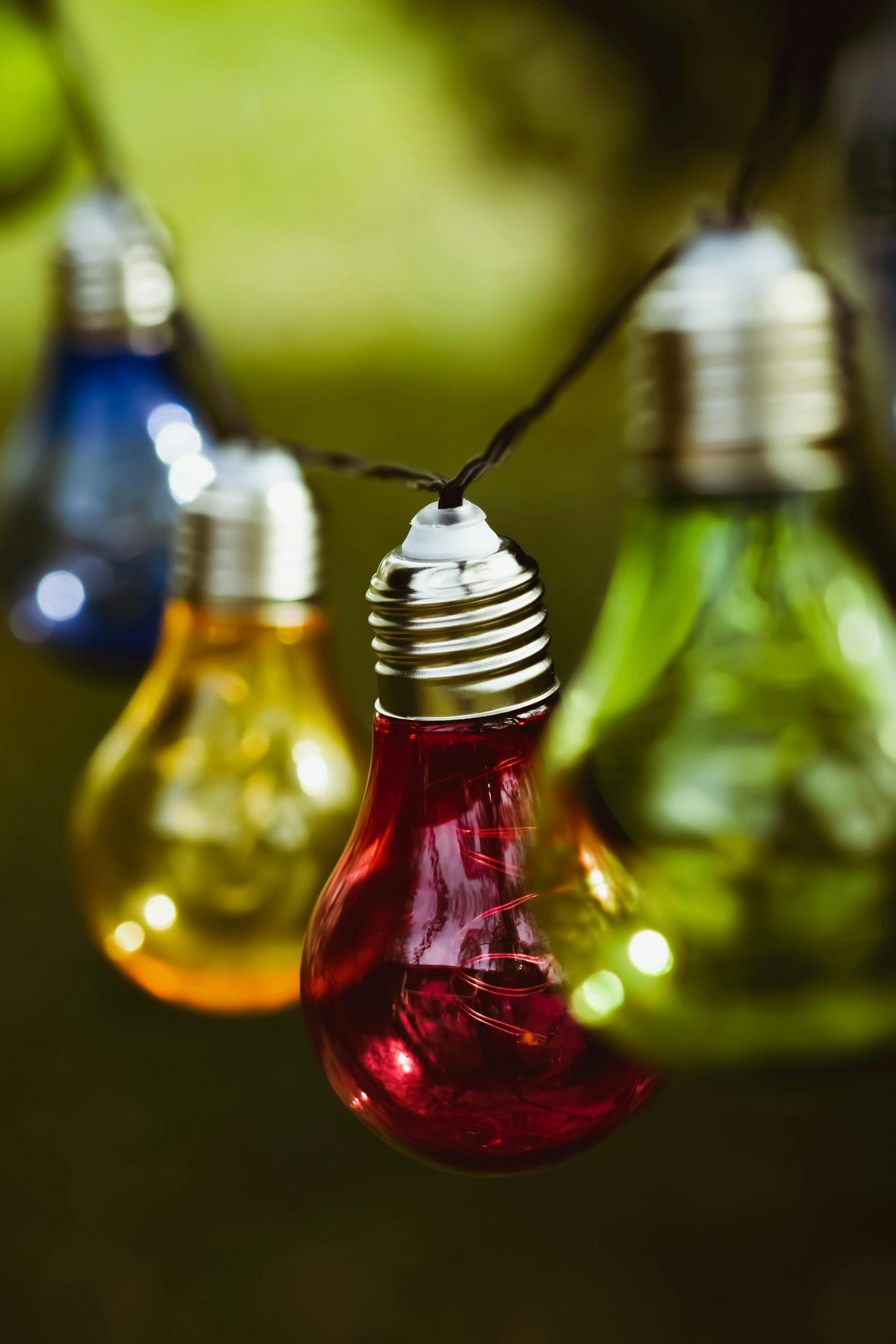 Colorful string lights in focus displaying vivid hues, perfect for festive occasions.
