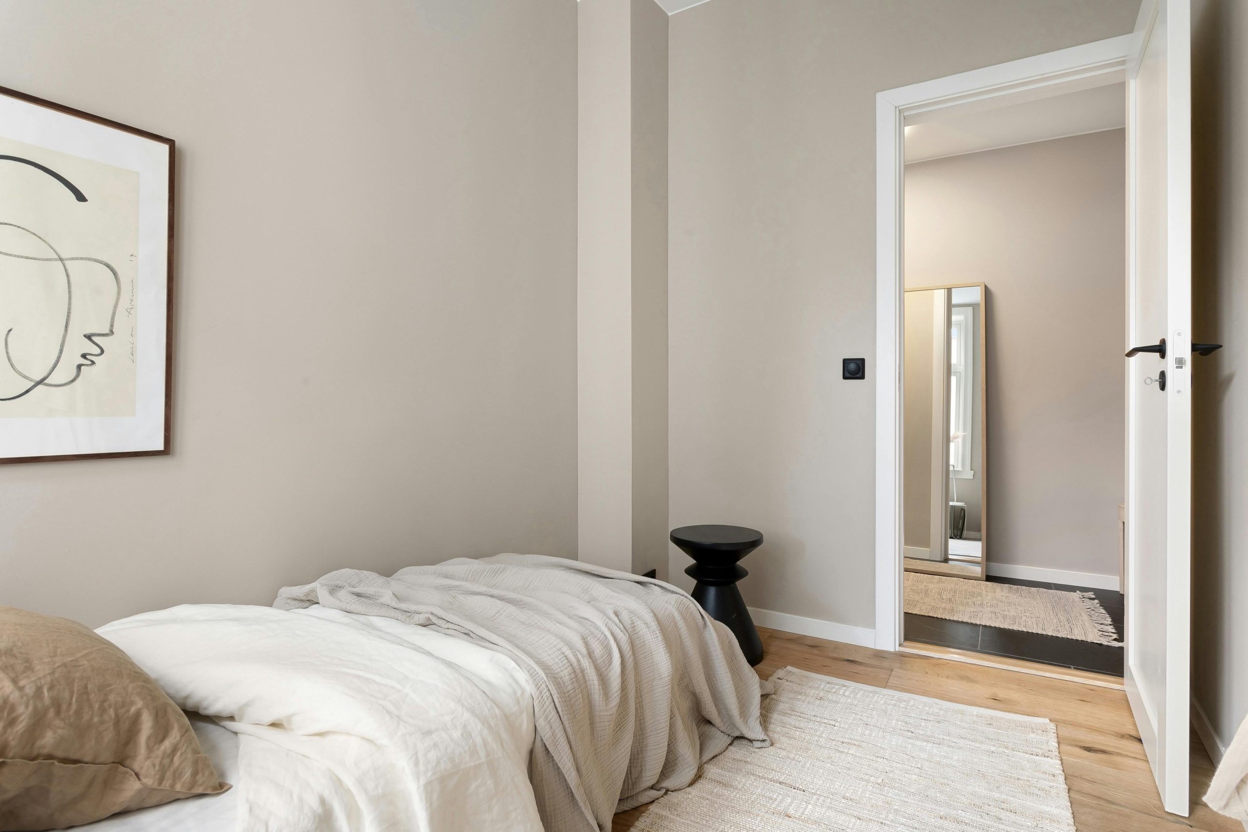 Cozy and minimalist bedroom with simple decor and elegant design.