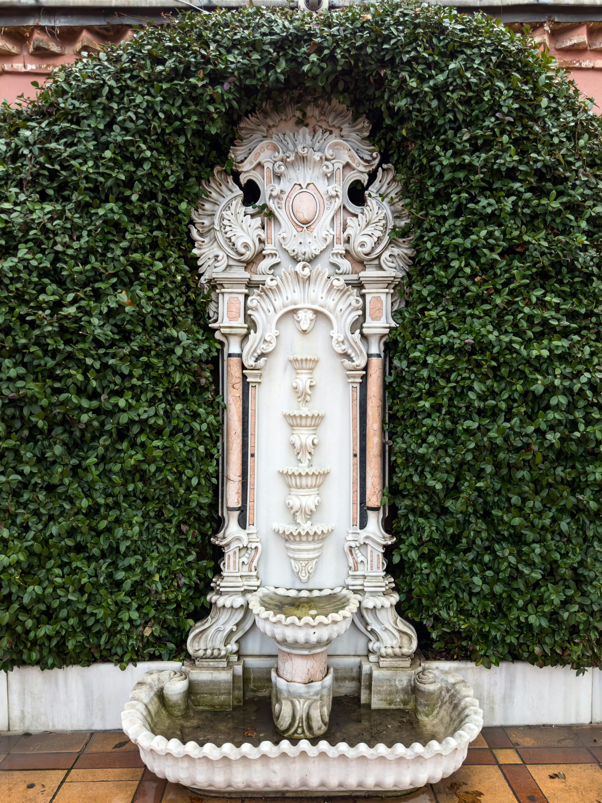 Elegant fountain design against lush greenery in Istanbul, Türkiye.