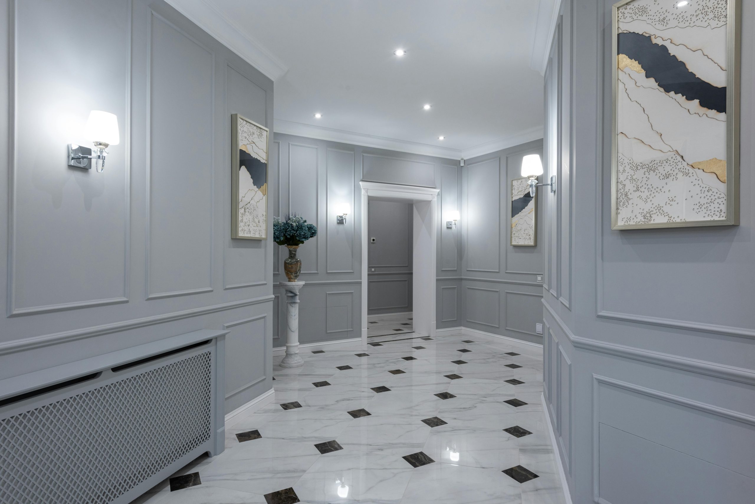 Interior of comfortable modern gray hall with sparkling clean floor with geometrical patterns