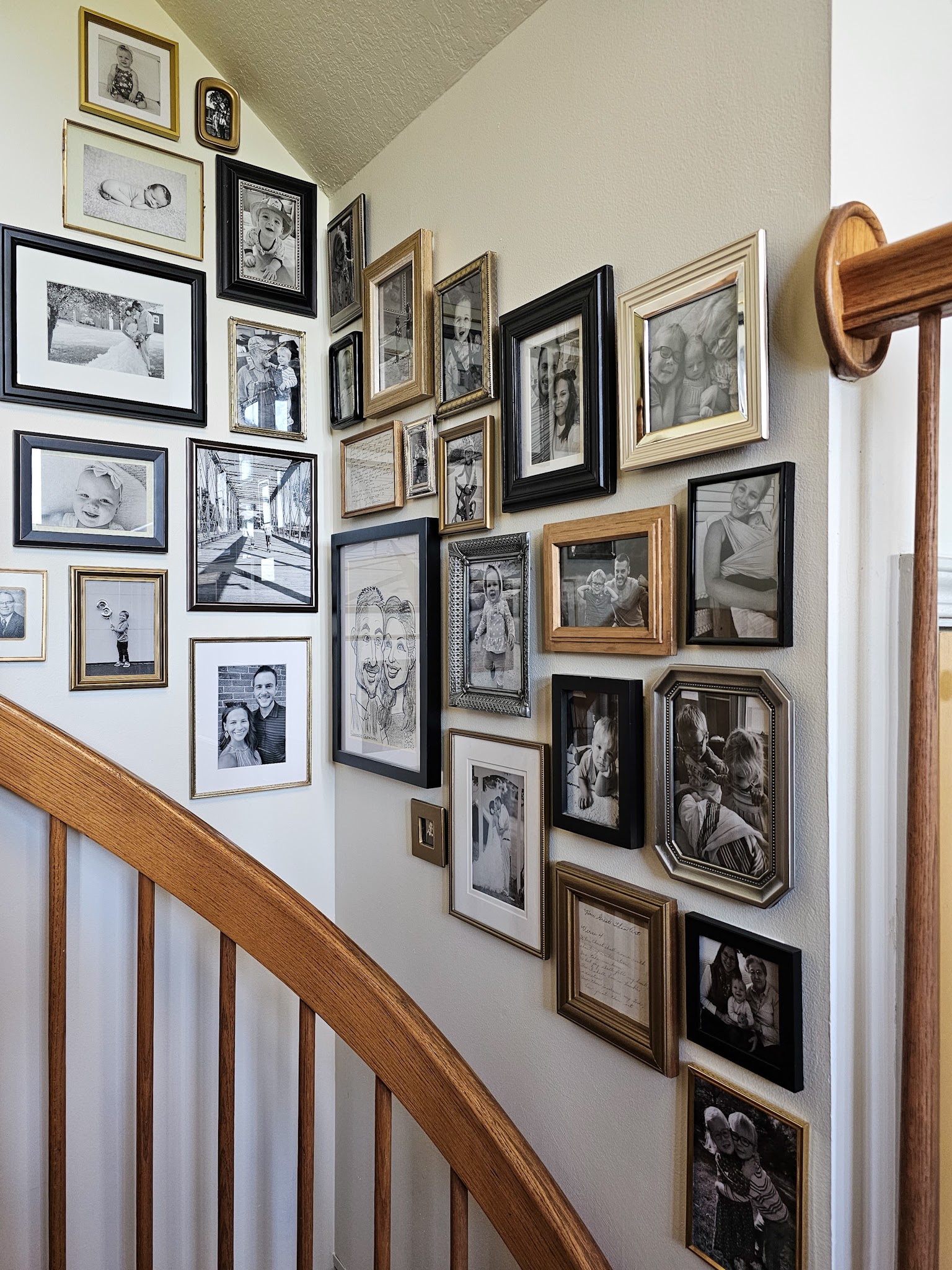 Upgrading Our Spiral Staircase Wall with Thrifted Frames – simplify the chaos