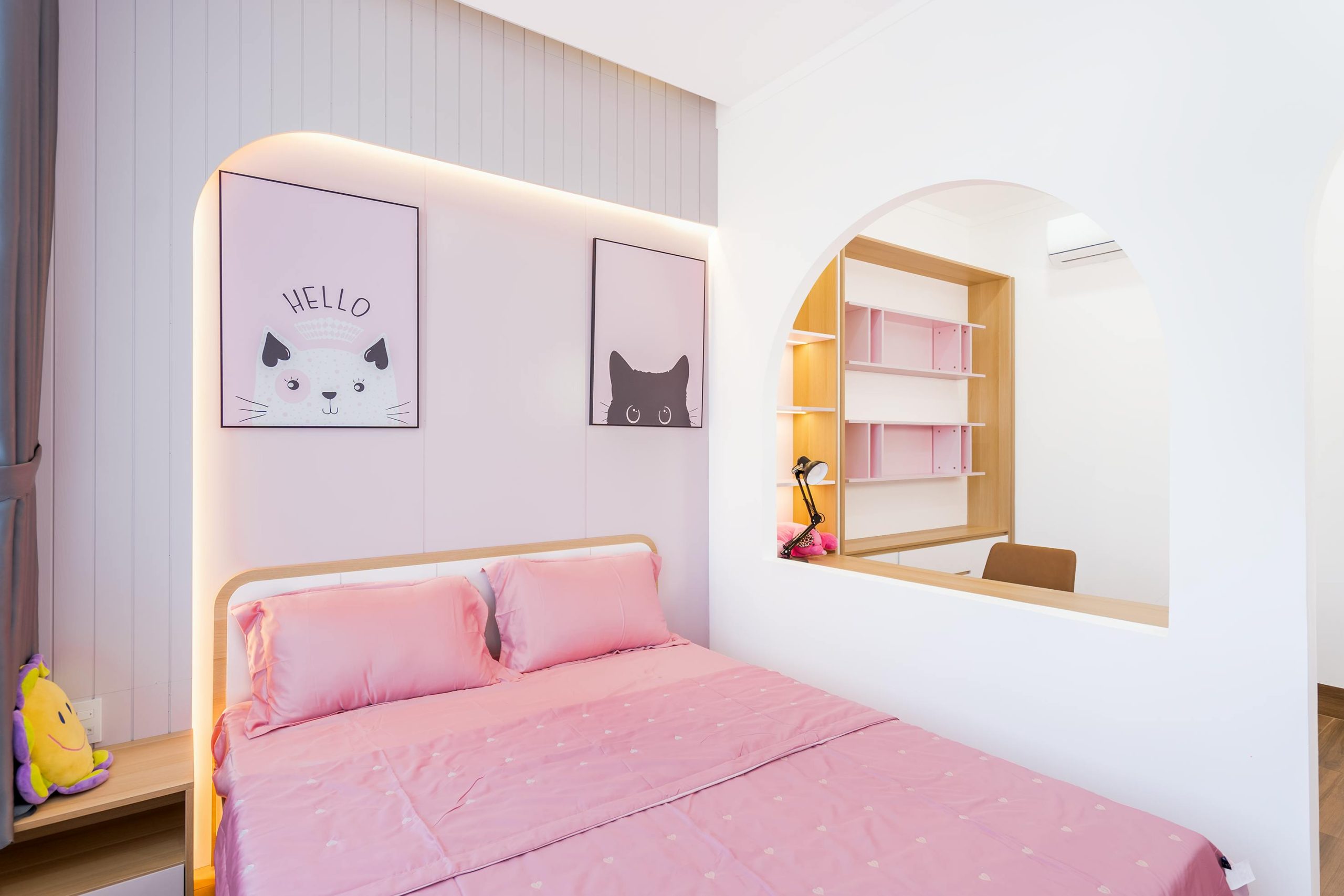 A cozy pink-themed bedroom with stylish decor, perfect for a modern interior design.