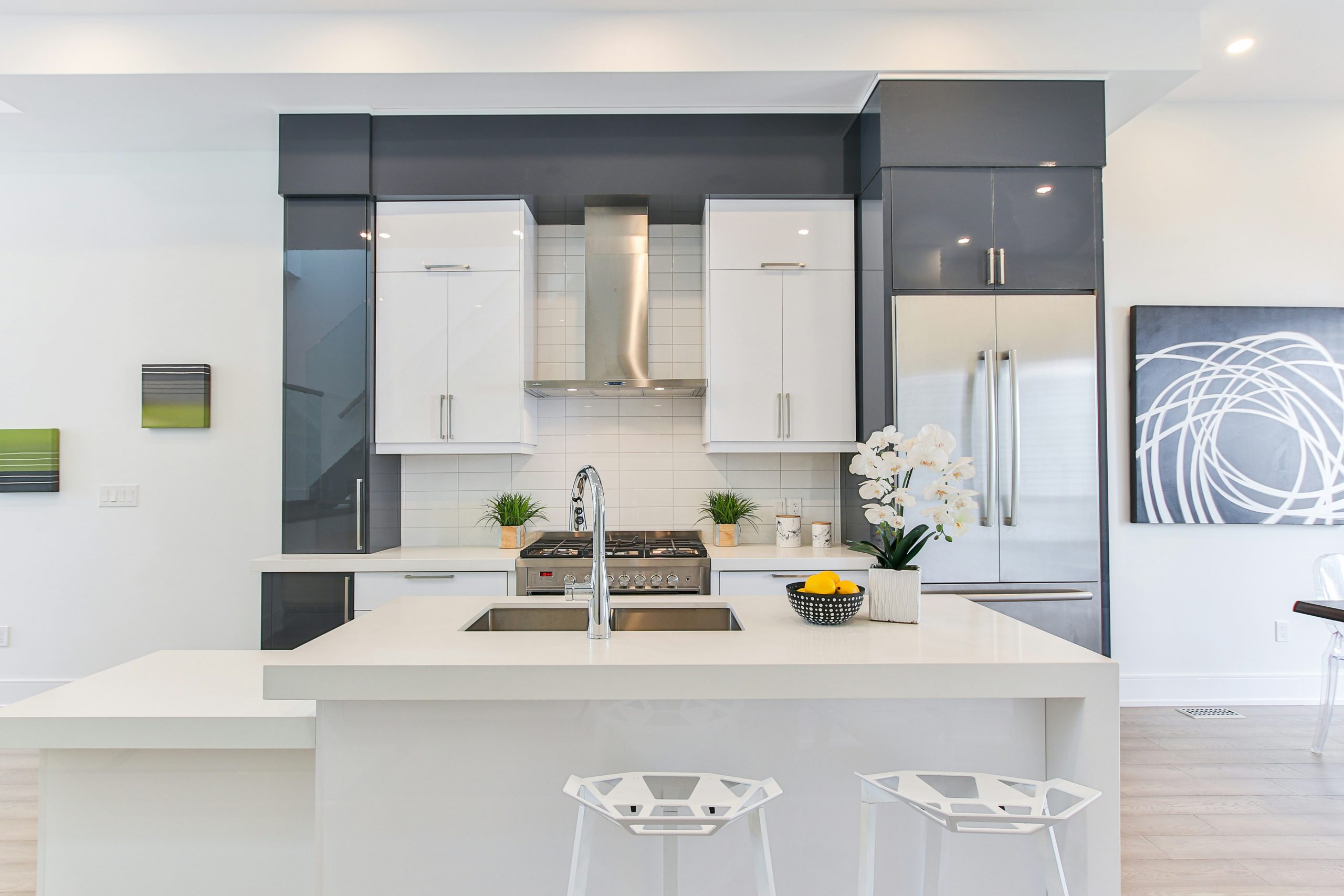 a kitchen with white cabinets