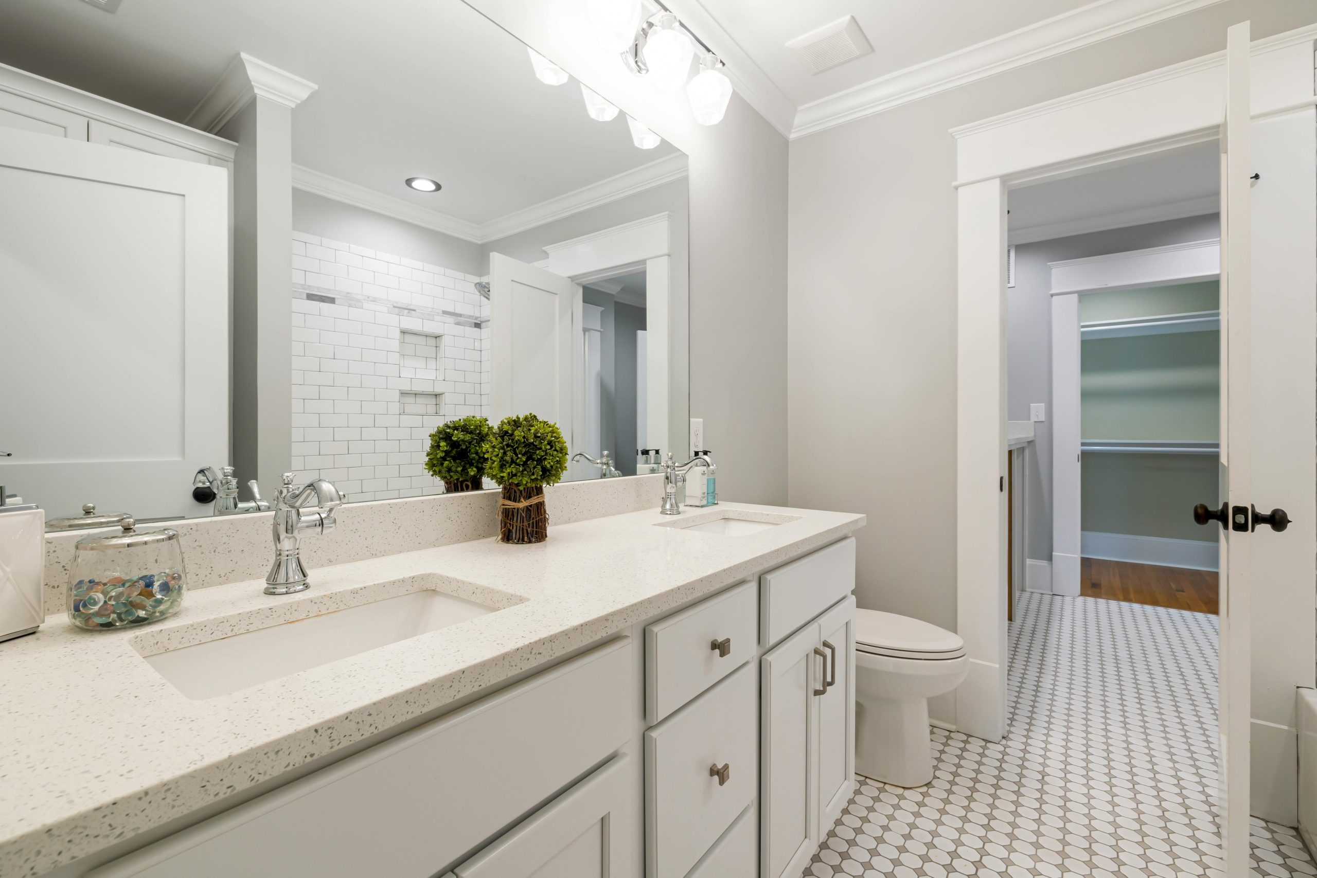 Bright and spacious modern bathroom with white fixtures and minimalist decor.