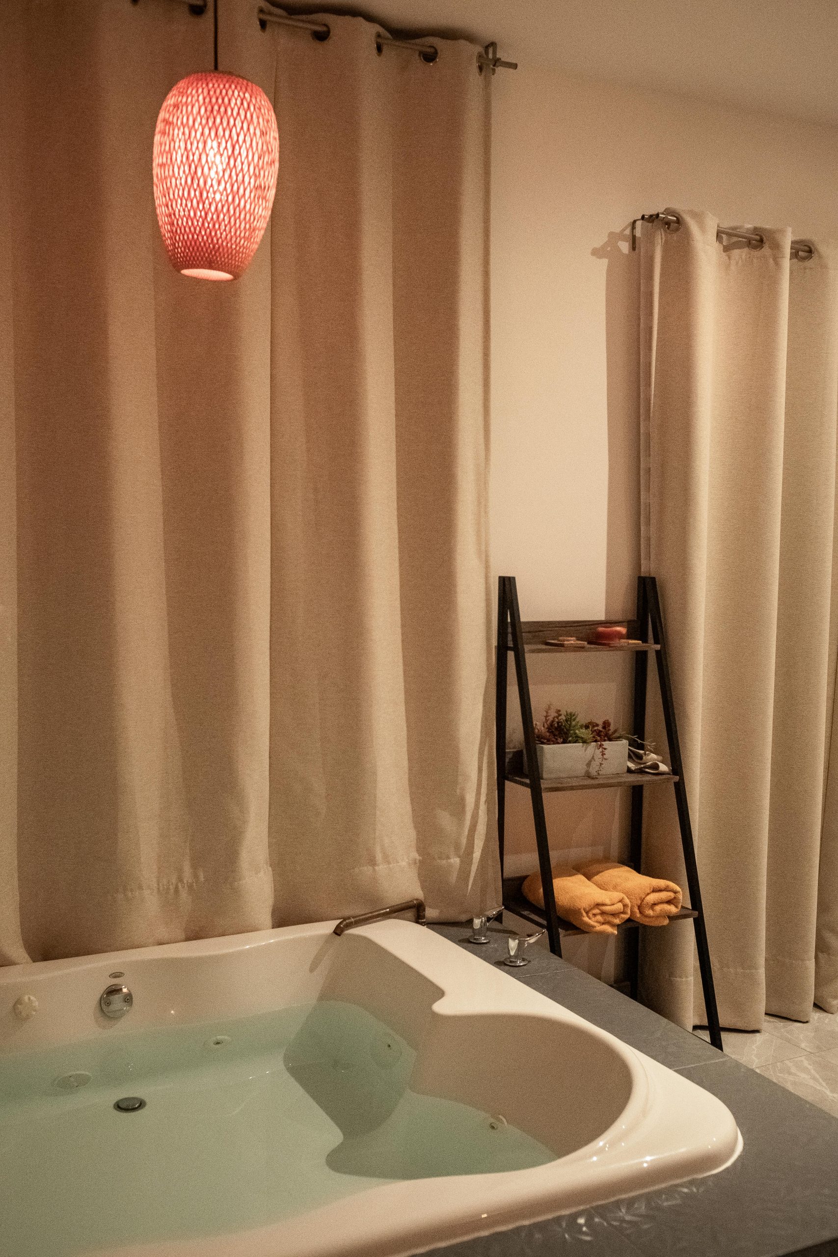 Contemporary bathroom setting featuring a luxurious bathtub and stylish decor.