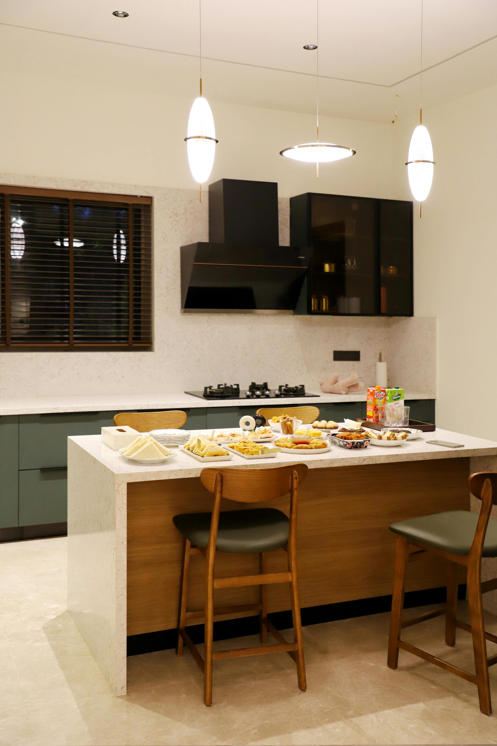 Cozy modern kitchen with a variety of food on the island table, perfect for culinary shoots.