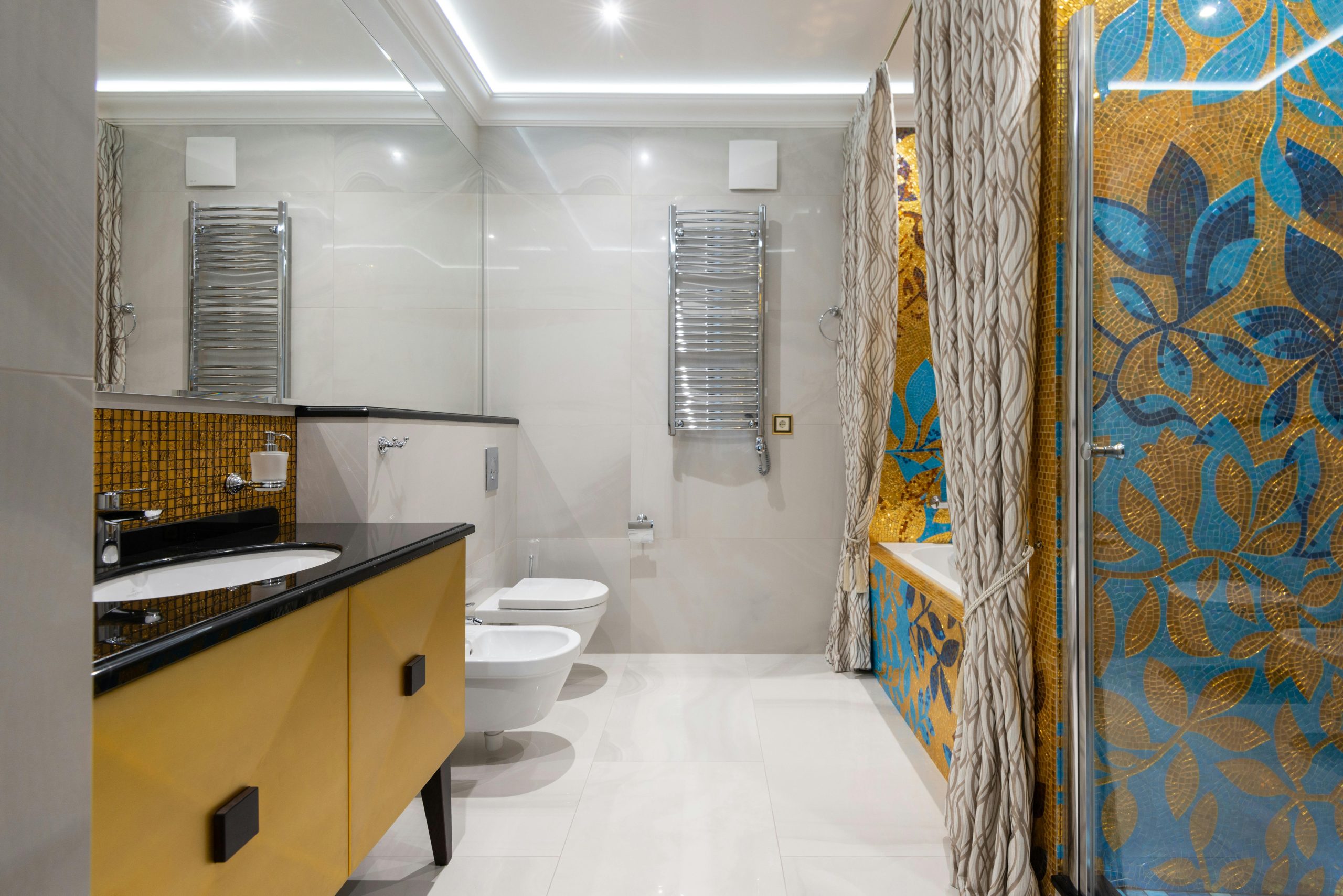 Elegant bathroom featuring a colorful floral mosaic, stylish fixtures, and modern design elements.