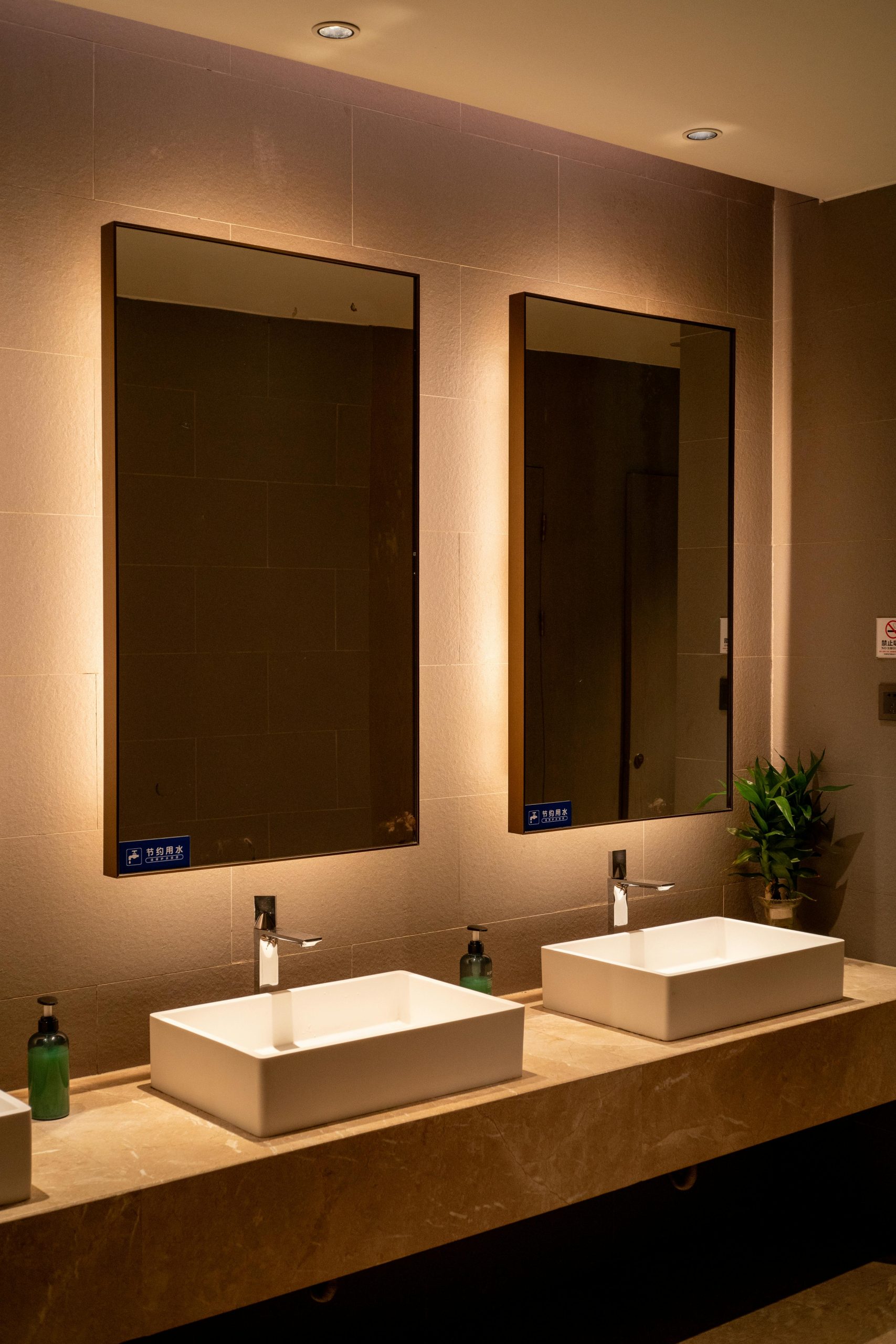 Elegant hotel bathroom featuring double sinks and mirrors, perfect for luxury interiors.