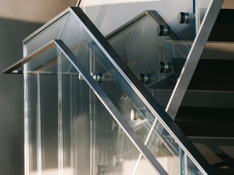 Glass staircase panels and other railings as details of design
