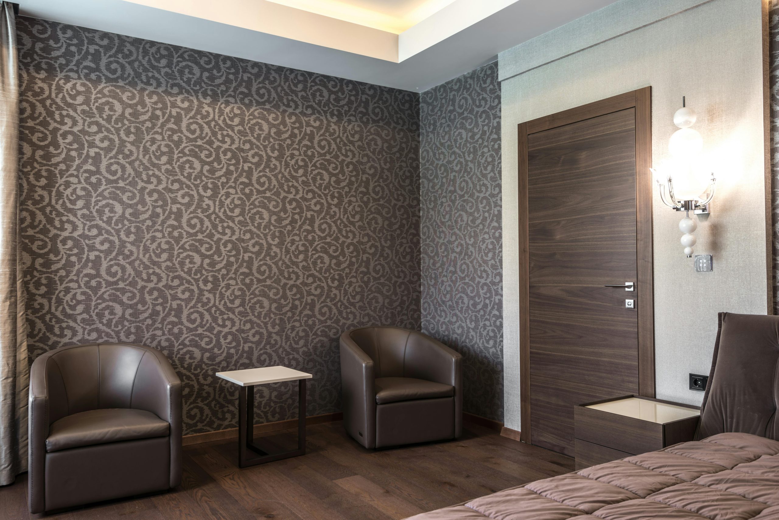 Luxurious hotel room featuring modern furniture and stylish decor.