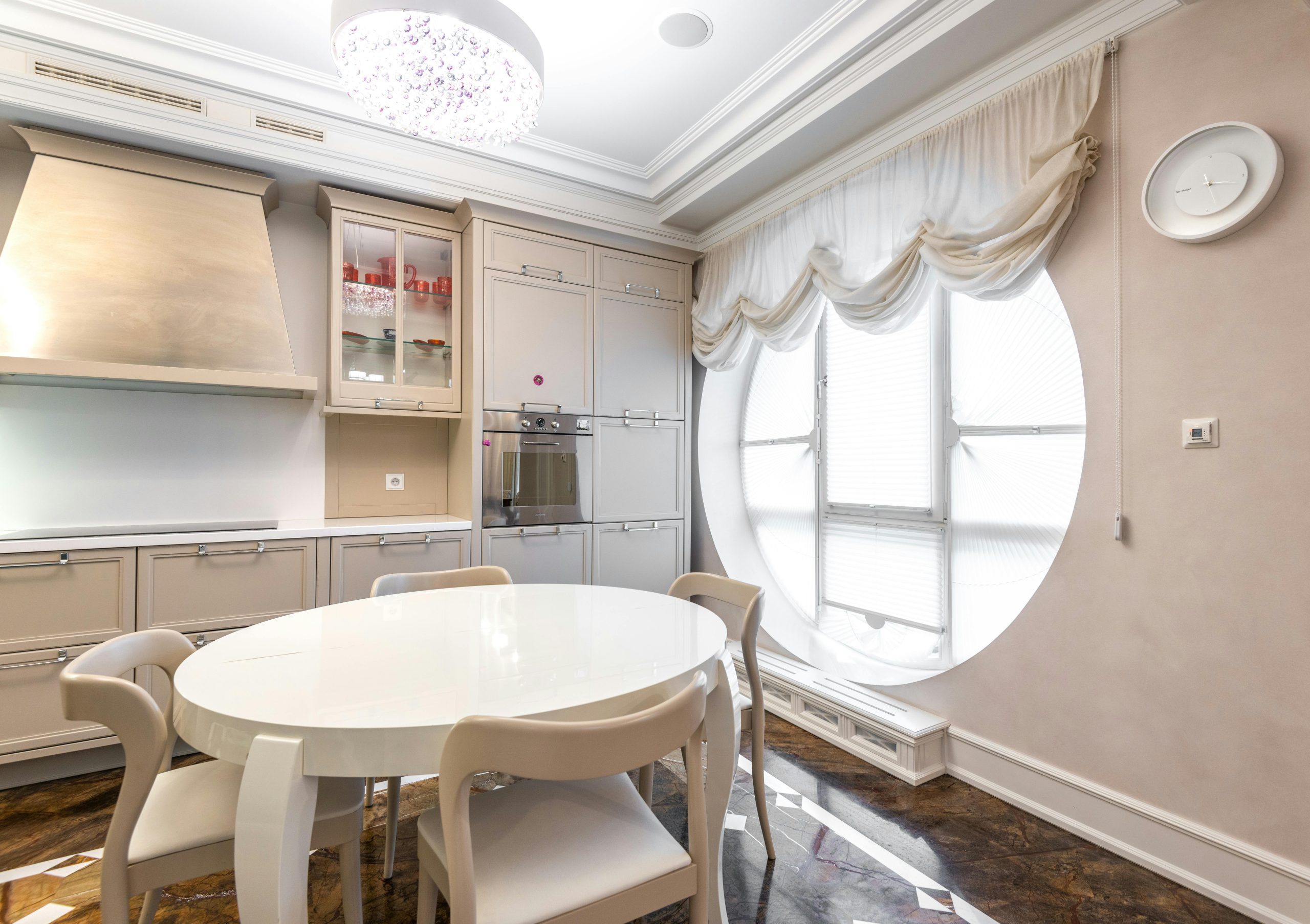Luxurious kitchen interior with modern furniture and elegant lighting. Bright and spacious dining area.