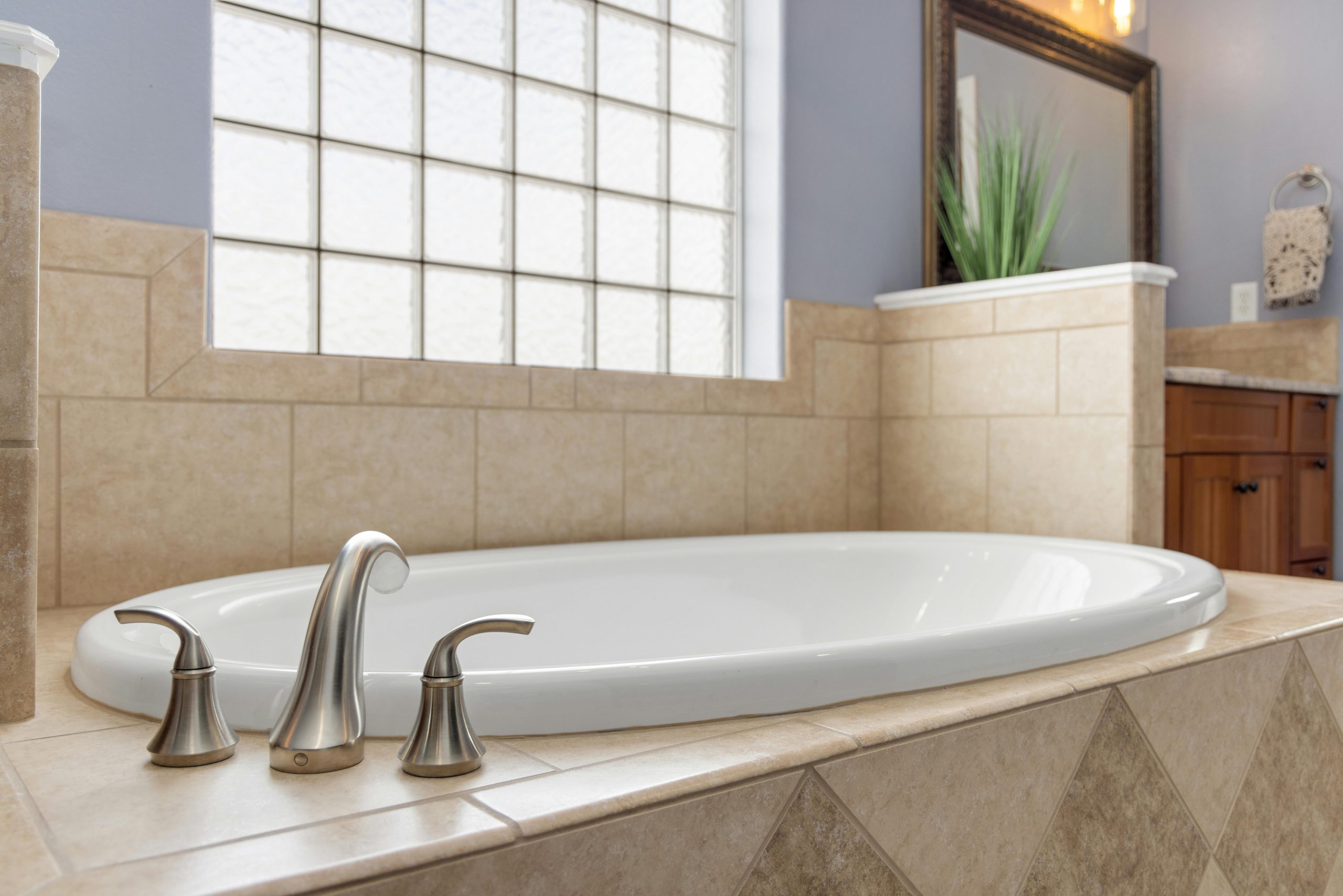 Luxurious modern bathroom showcasing an elegant bathtub with stylish faucet.
