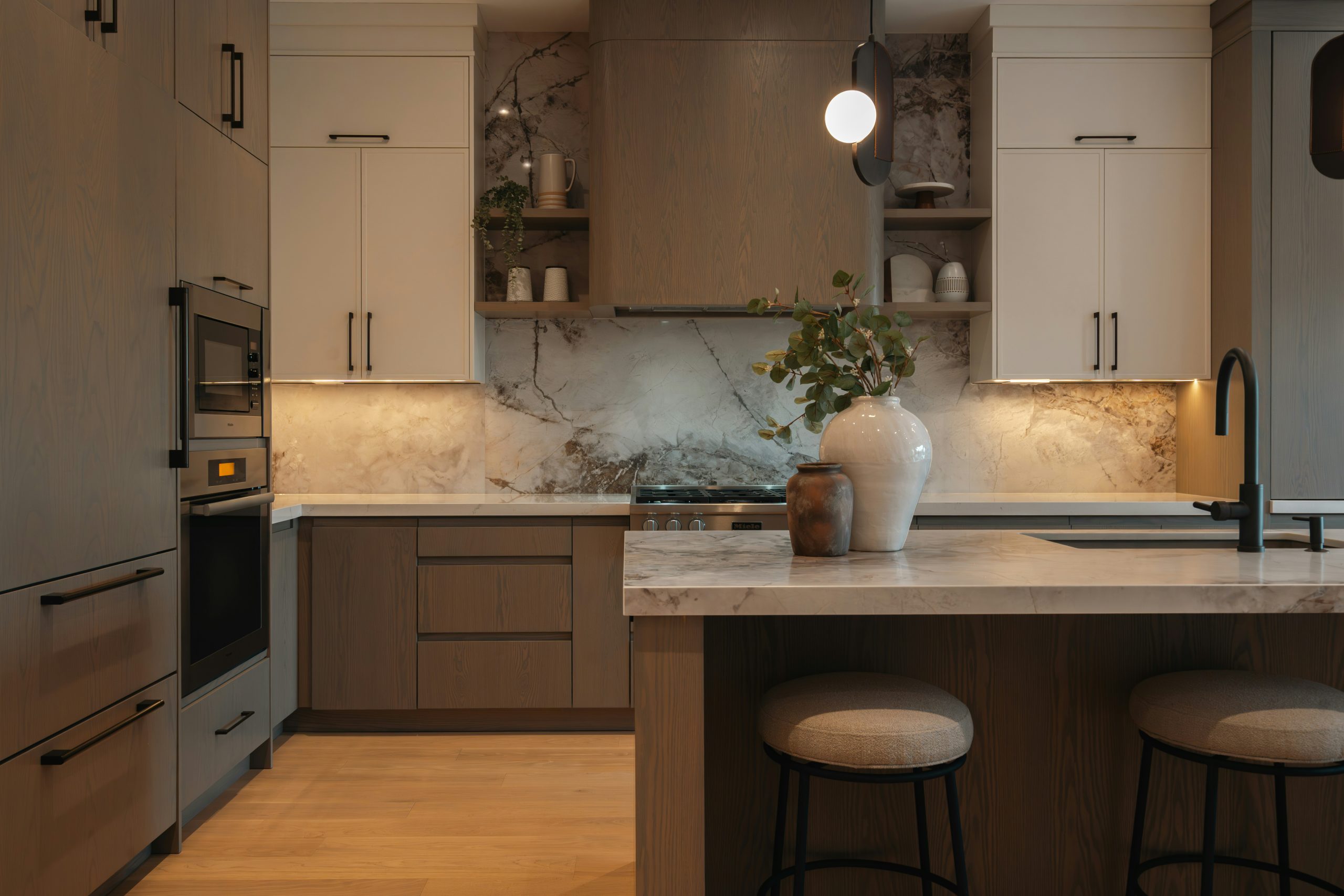 Modern kitchen with island and pendant light.
