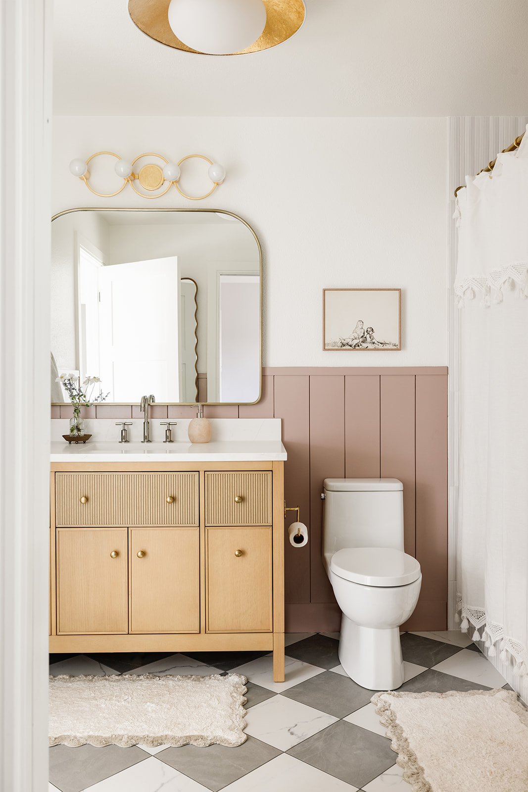 Neutral Boho Modern Girls Bathroom with Mauve and Gold Accents // Shop the Look — peggyhaddadinteriors.com