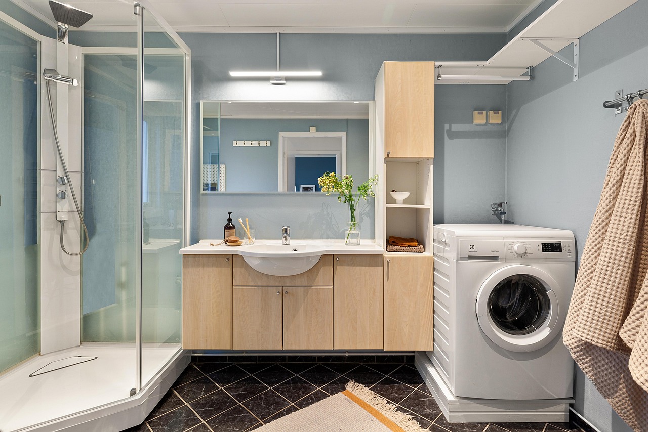 real estate, interior, bath room, toilet, shelf, sink, luxury, art, table, wood, chair, shampoo, nature, shower, washing machine, mirror, towel, decor, cabinet, plant, carpet