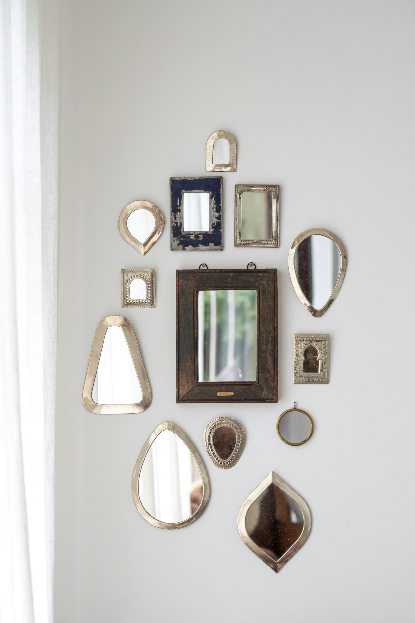 a collection of Moroccan mirrors on a wall