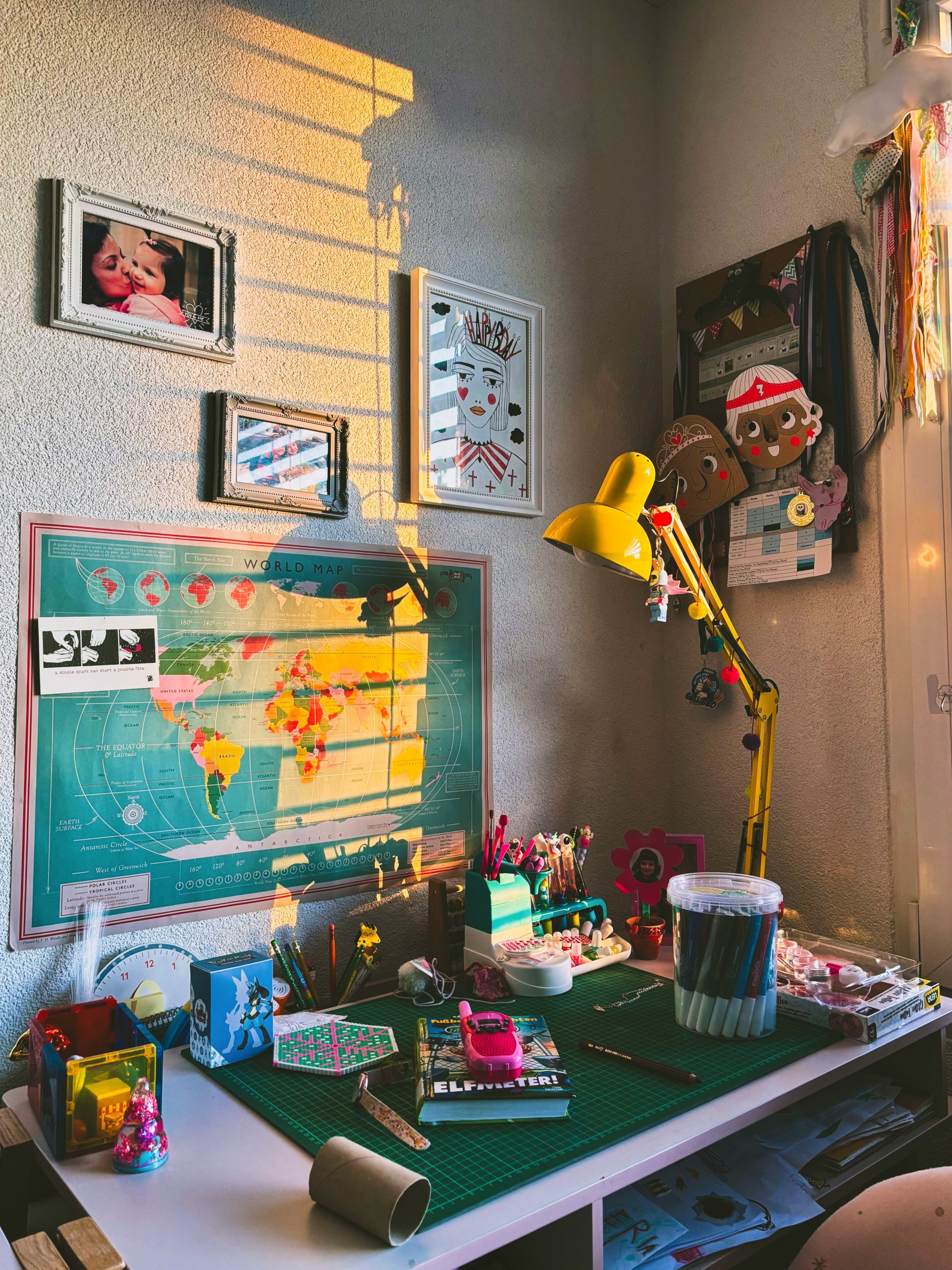 A colorful, creative workspace bathed in sunlight.