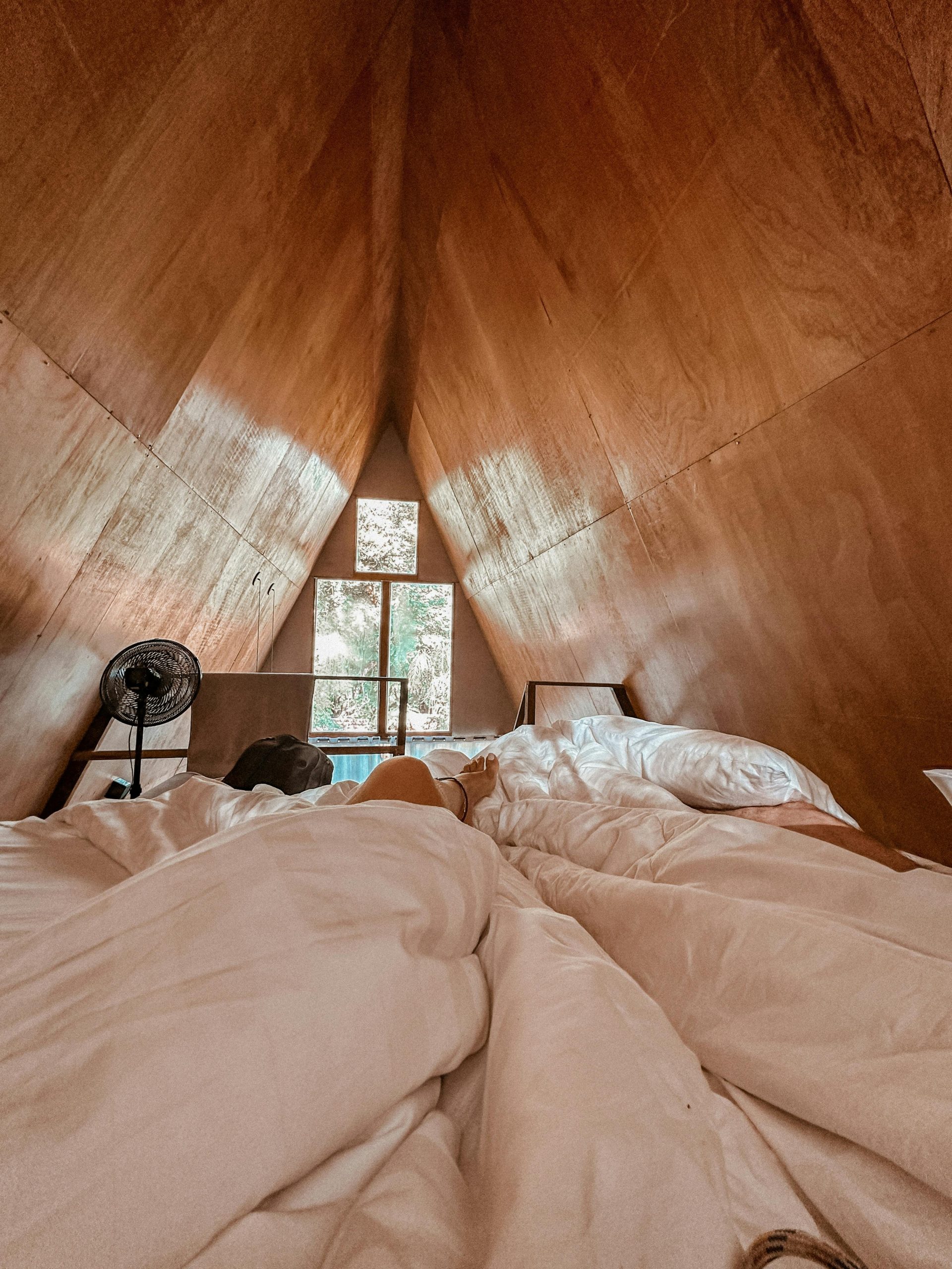 A cozy and warm wooden loft bedroom offering a relaxing retreat.