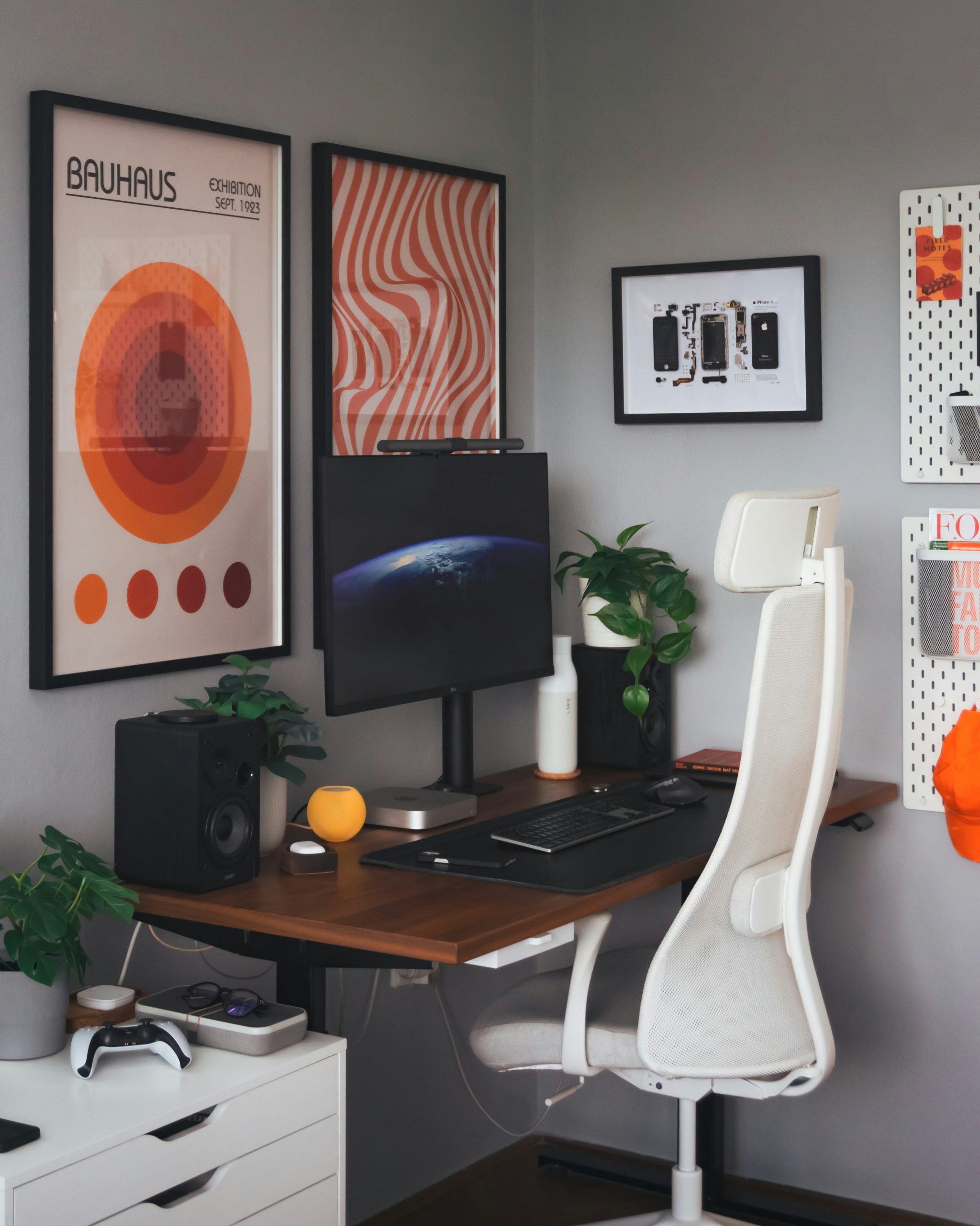 A desk with a computer and a chair in a room