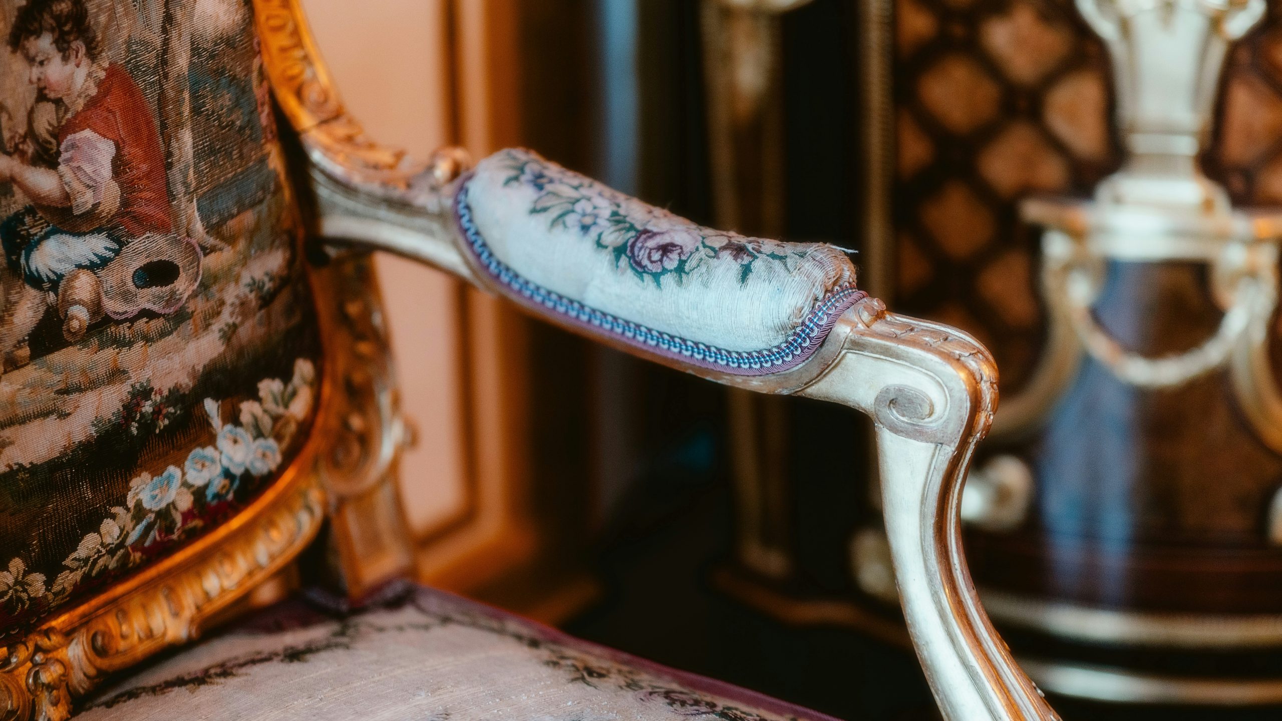 A fancy chair with a fancy arm rest