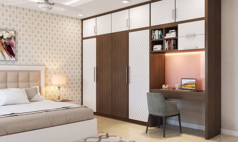 A Three-Door Wardrobe Design With An Attached Study Unit - DesignCafe